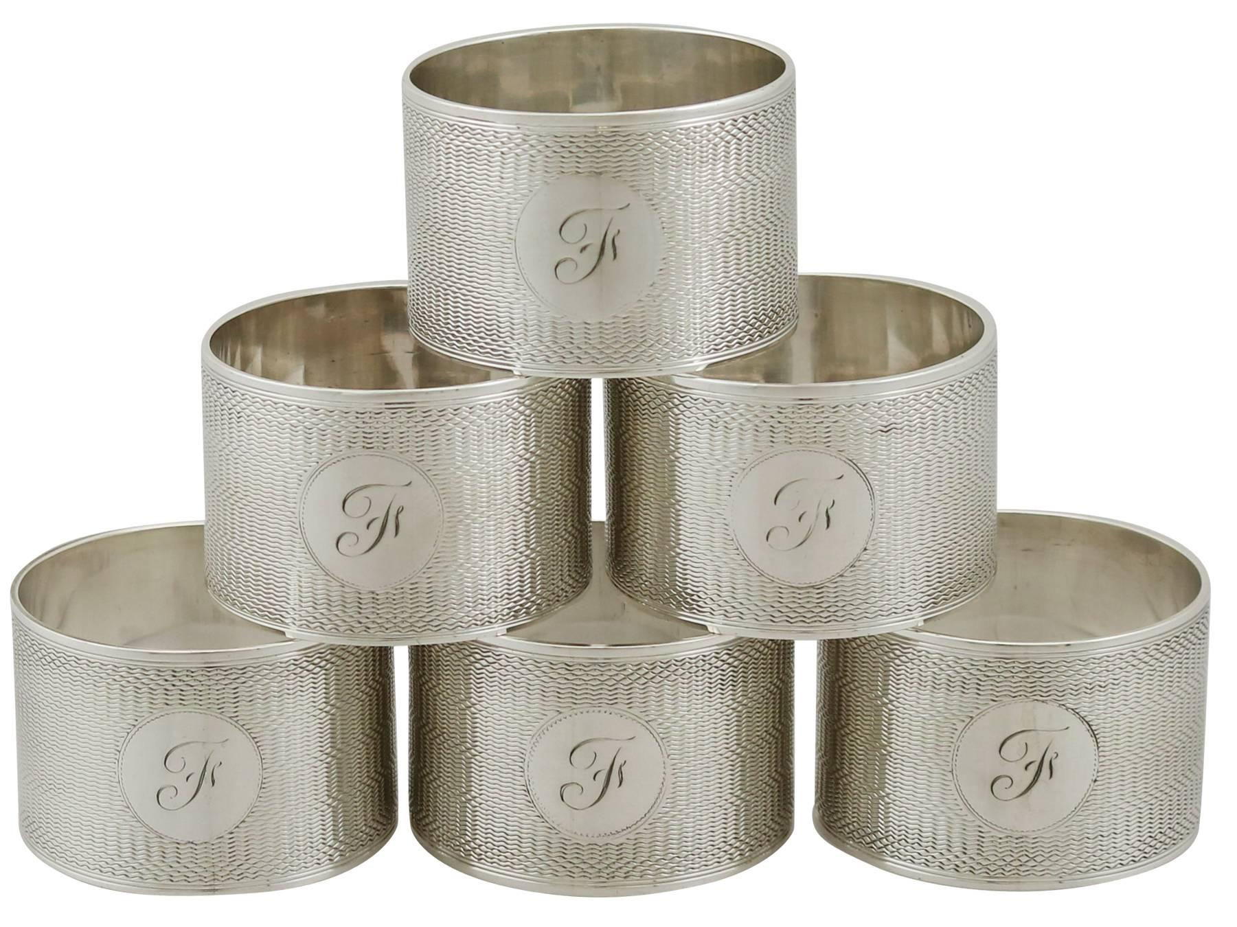 An exceptional, fine and impressive set of six antique George V English sterling silver napkin rings by Emile Viner - boxed; an addition to or dining silverware collection.

This exceptional set of antique George V silver napkin rings consists of