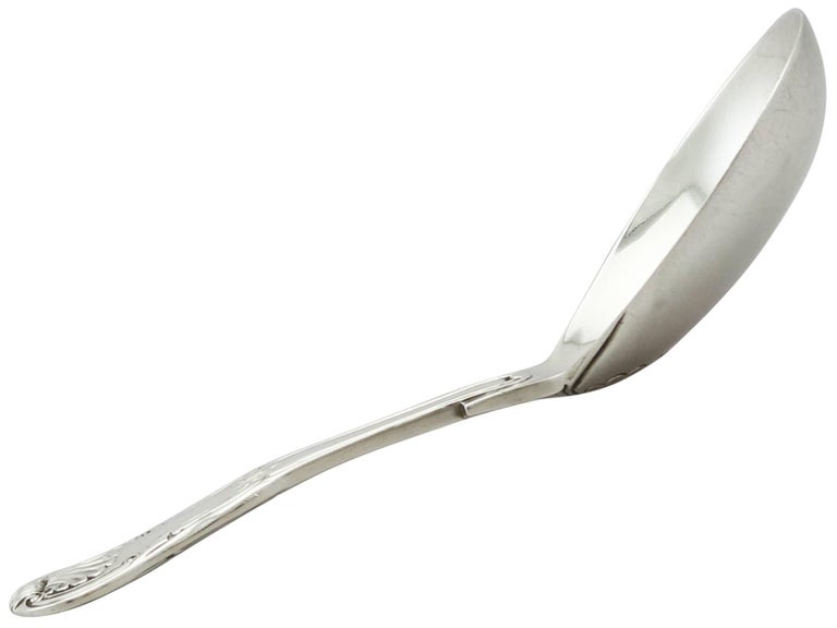 An exceptional, fine and impressive antique Georgian English sterling silver caddy spoon; an addition to our teaware collection.

This exceptional antique George III sterling silver caddy spoon has been crafted in the King's shape, Hourglass