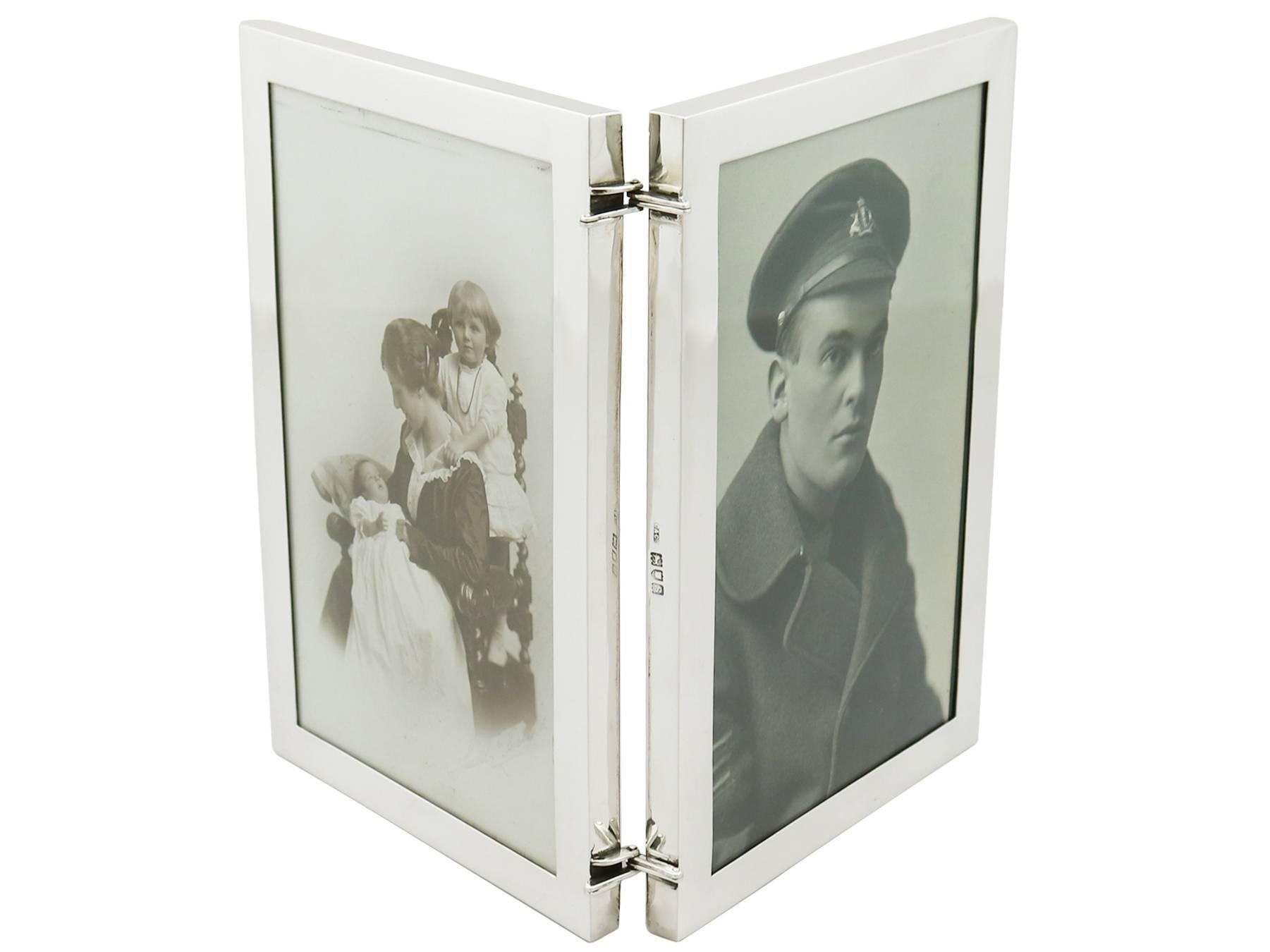 An exceptional, fine and impressive antique George V sterling silver double photograph frame; an addition to our ornamental silverware collection.

This exceptional antique George V sterling silver double photo frame has a plain rectangular form