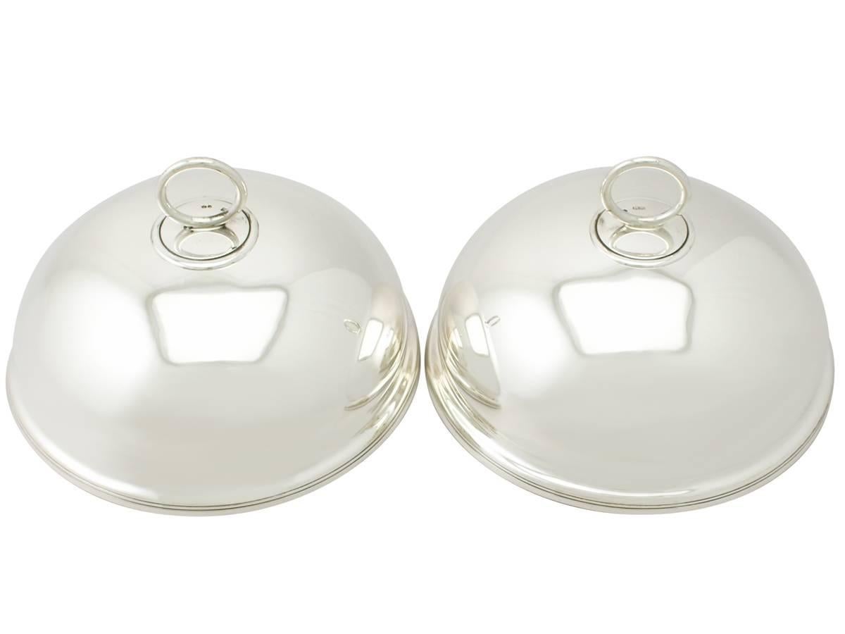 A fine and impressive pair of antique Victorian English sterling silver dish covers; an addition to dining silverware collection

These fine antique Victorian sterling silver dish covers have a plain circular domed form.

The surface of each