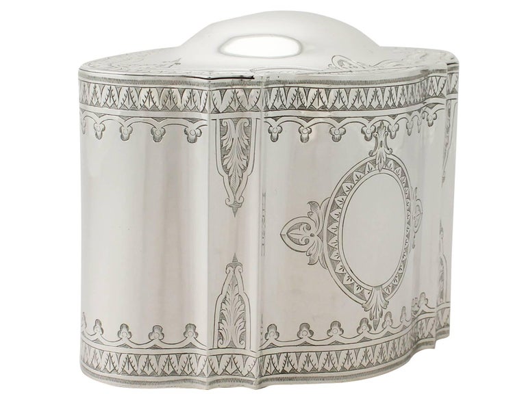 An exceptional, fine and impressive, large antique Victorian English sterling silver locking tea caddy; an addition to our silver teaware collection.

This exceptional antique Victorian sterling silver tea caddy has an oval shaped form.

The
