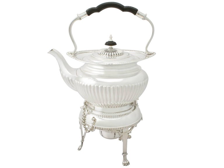 A fine and impressive antique Edwardian English sterling silver four piece tea service in the Queen Anne style; an addition to our silver teaware collection.

This fine antique Edwardian sterling silver four piece tea service / set consists of a