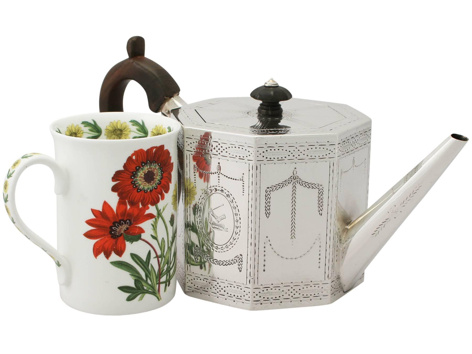 A fine antique Victorian English sterling silver octagonal teapot; an addition to our diverse silver teaware collection.

This fine and unusual Victorian English sterling silver teapot has an octagonal panelled form.

The upper and lower