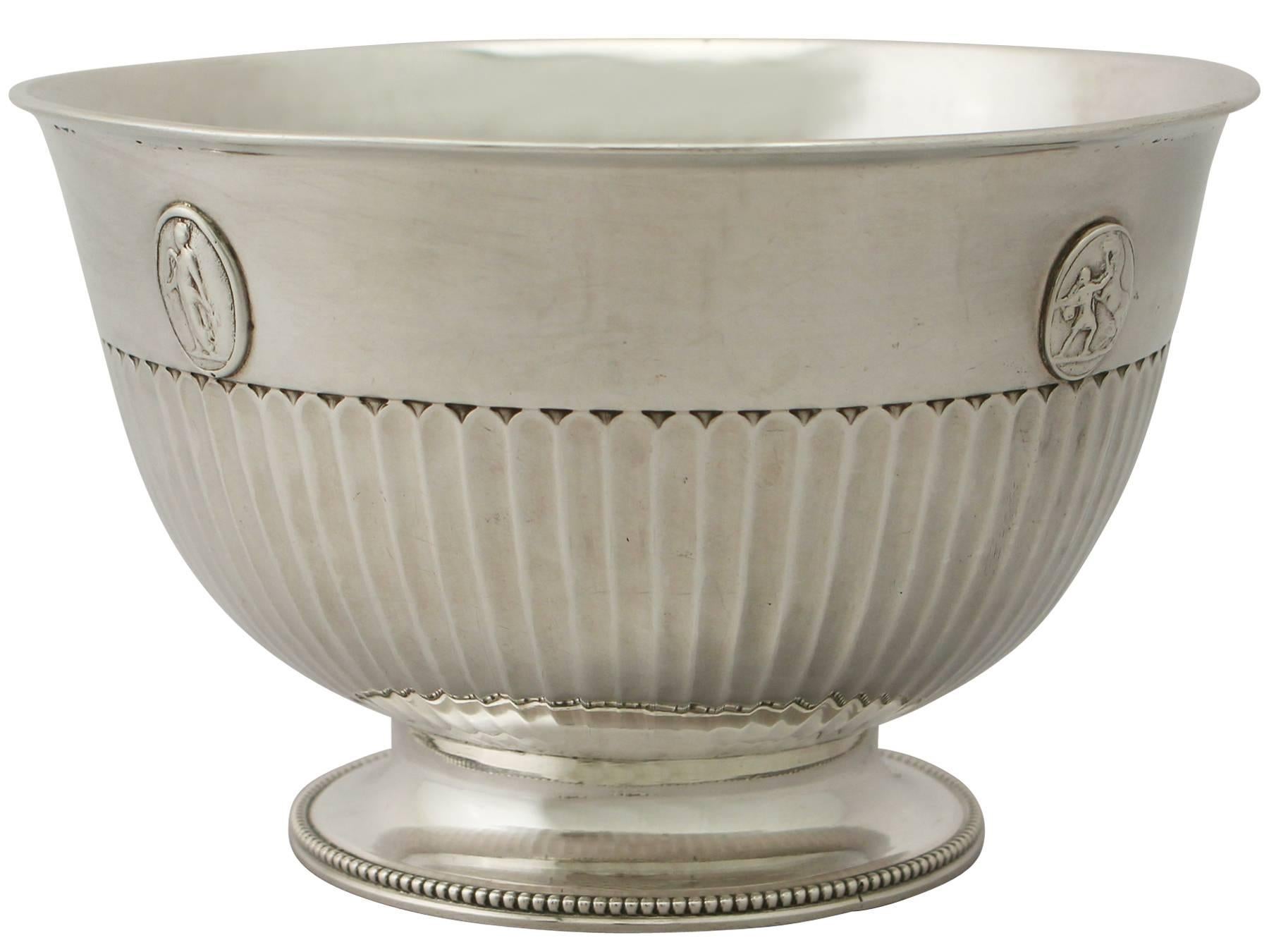 An exceptional, fine and impressive antique George III English sterling silver bowl made by Benjamin Smith III; an addition to our Georgian silverware collection.

This exceptional antique George III sterling silver bowl has a circular rounded