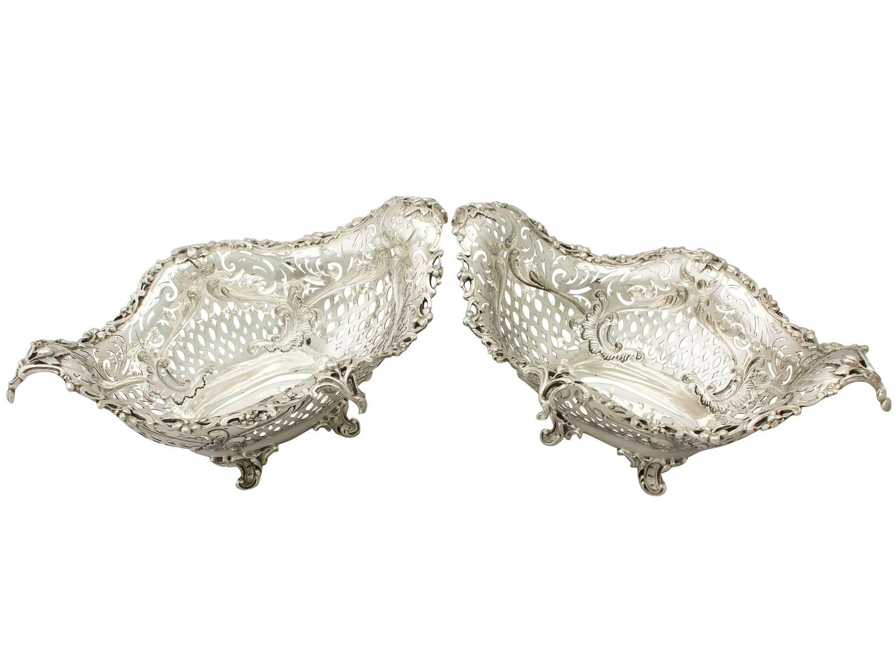 An exceptional, fine and impressive pair of antique Victorian English sterling silver presentation fruit dishes; part of our diverse silver baskets and dishes collection.

These exceptional antique Victorian sterling silver presentation dishes