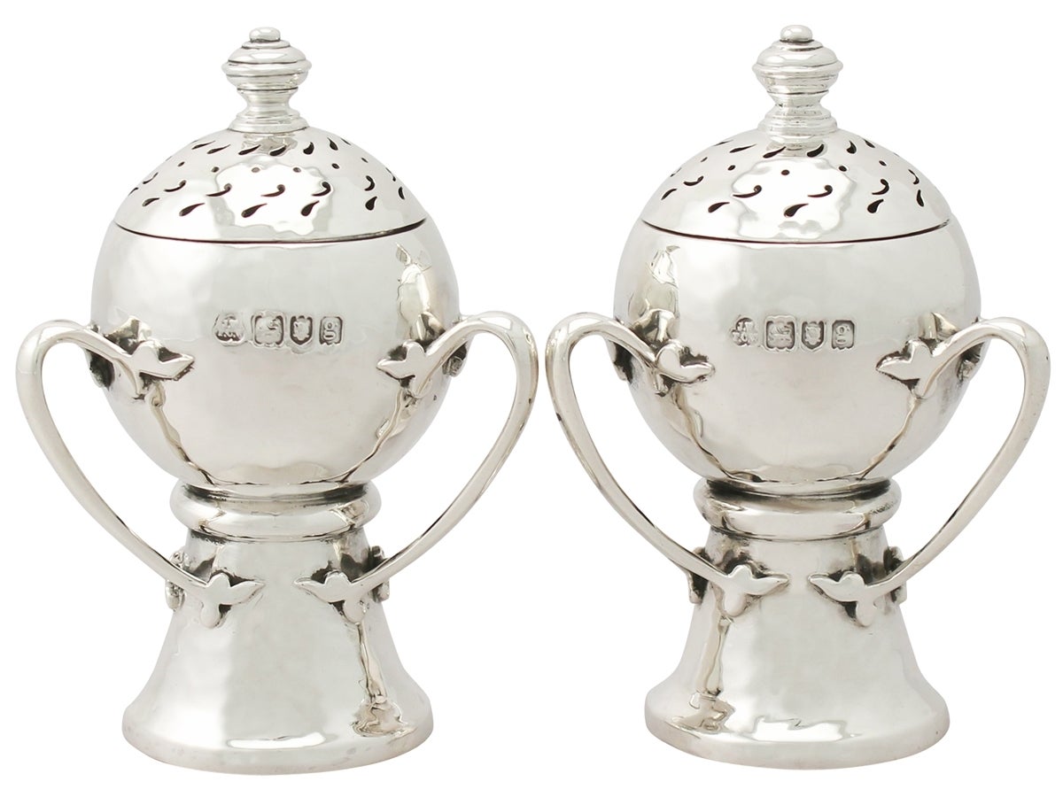 An exceptional, fine and impressive, large pair of antique Edwardian English sterling silver peppers in the Arts and Crafts style - boxed; an addition to our silver cruets/condiments collection.

These exceptional antique Edwardian sterling silver