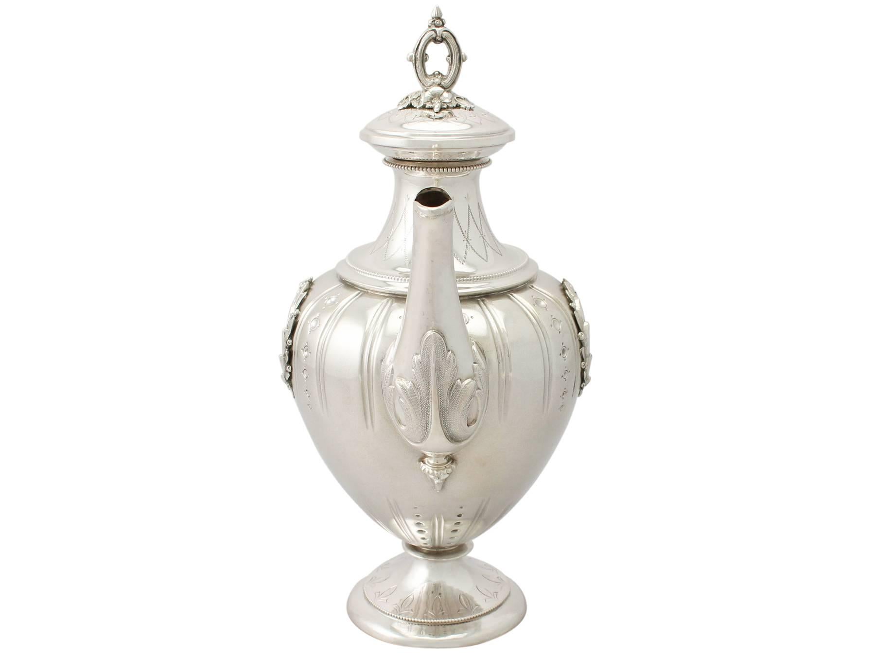 A fine and impressive antique German silver coffee pot; part of our silverware collection.

This impressive antique German silver coffee pot has an urn shaped form onto a circular spreading foot.

The surface of this fine coffee pot has a