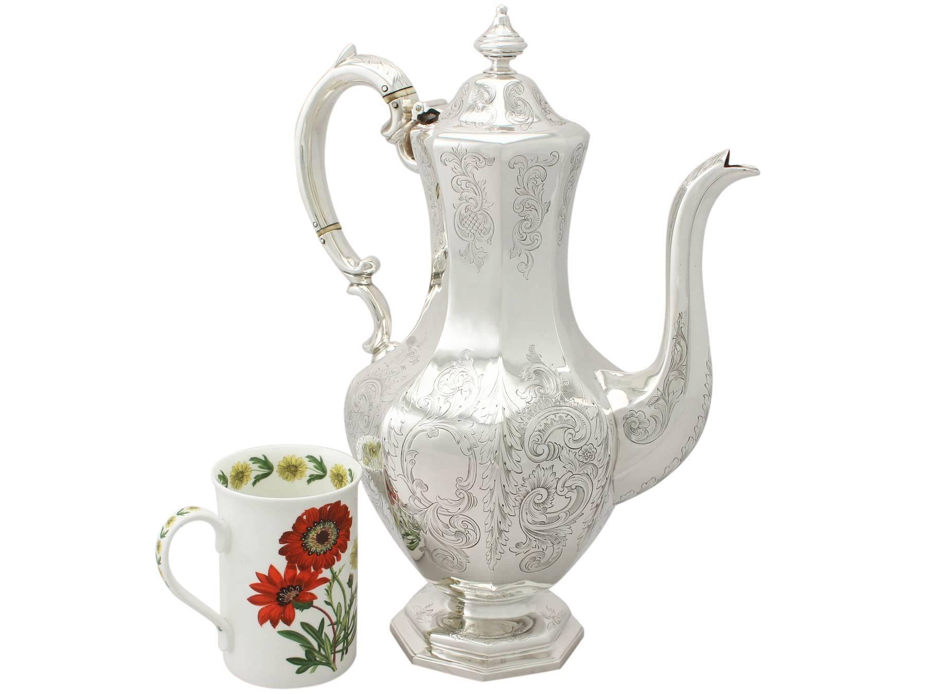 An exceptional, fine and impressive, large antique early Victorian Scottish sterling silver coffee pot; part of our silverware collection

This exceptional, early Victorian Scottish sterling silver coffee pot has an octagonal panelled baluster