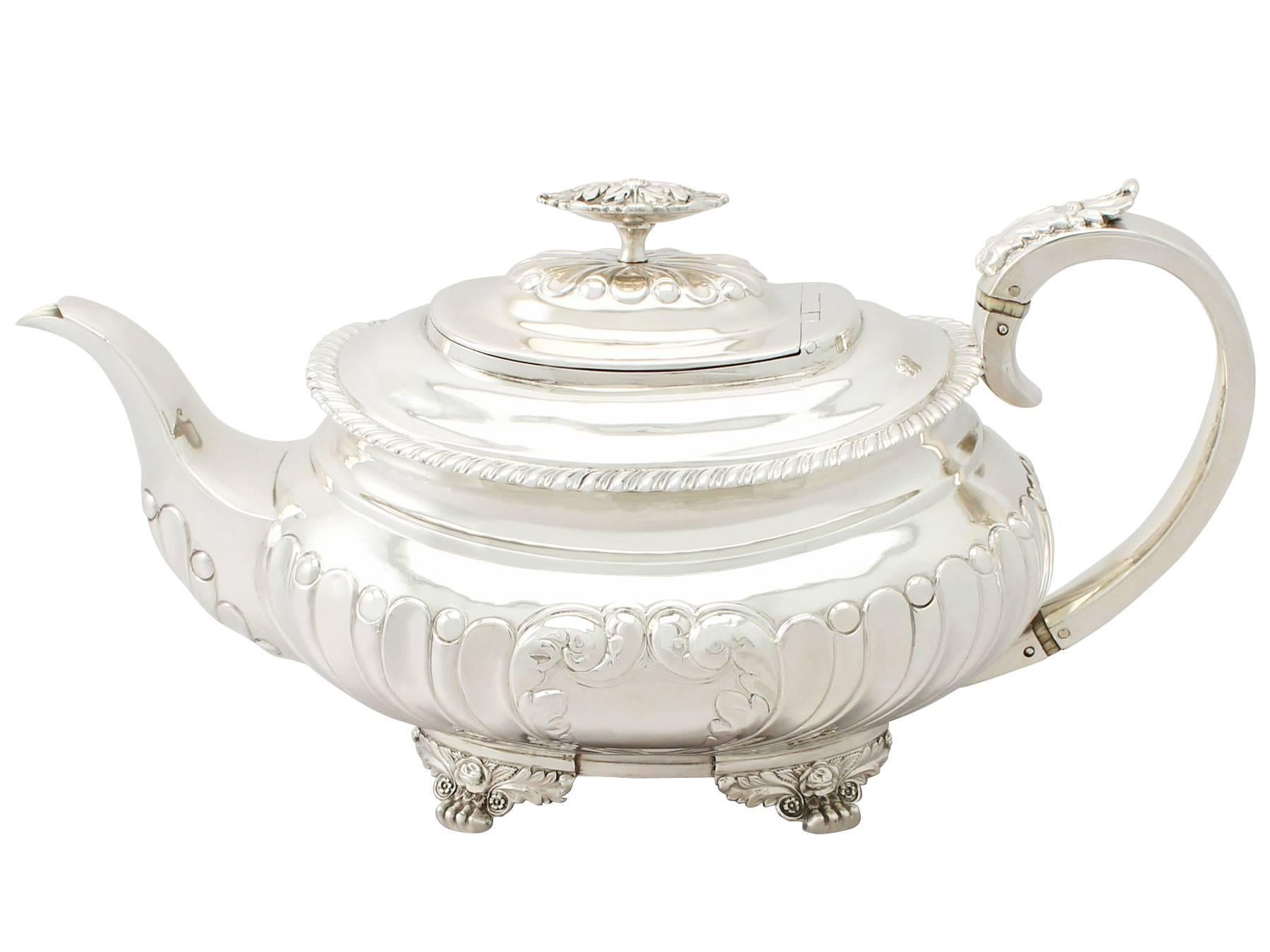 A fine and impressive antique George IV English sterling silver three piece tea set/service made in the Regency style; part of our silver teaware collection.

This impressive antique George IV 3 piece silver tea set consist of a teapot, cream jug