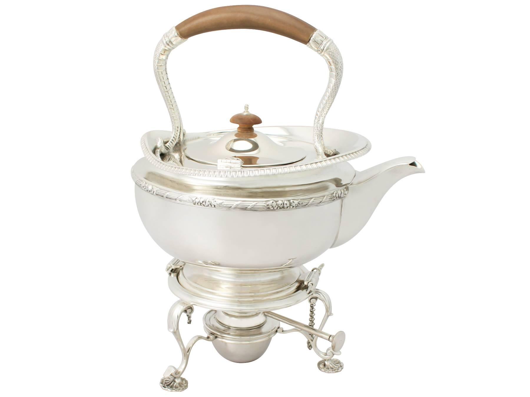 A  exceptional, fine and impressive antique George V English sterling silver four piece tea service / set; part of our silver teaware collection.

The pieces of this exceptional antique sterling silver four piece tea service consists of a spirit