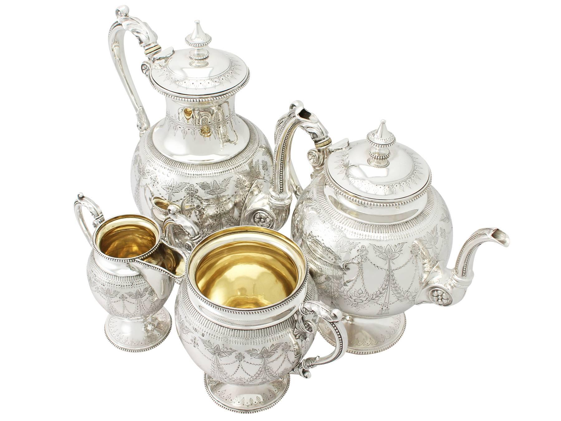 A fine and impressive antique Victorian English sterling silver four piece tea and coffee service / set; part of our silver teaware collection.

The pieces of this impressive antique Victorian sterling silver four piece tea and coffee service have