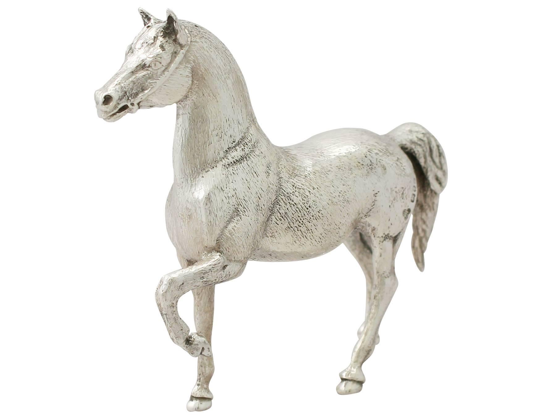 A fine and impressive vintage Elizabeth II English cast sterling silver ‘horse’; an addition to our animal related silverware collection.

Dimensions

Height to top of ear 9.4cm/3.7”
Depth 2.8cm/1.1”
Length from nose to tail