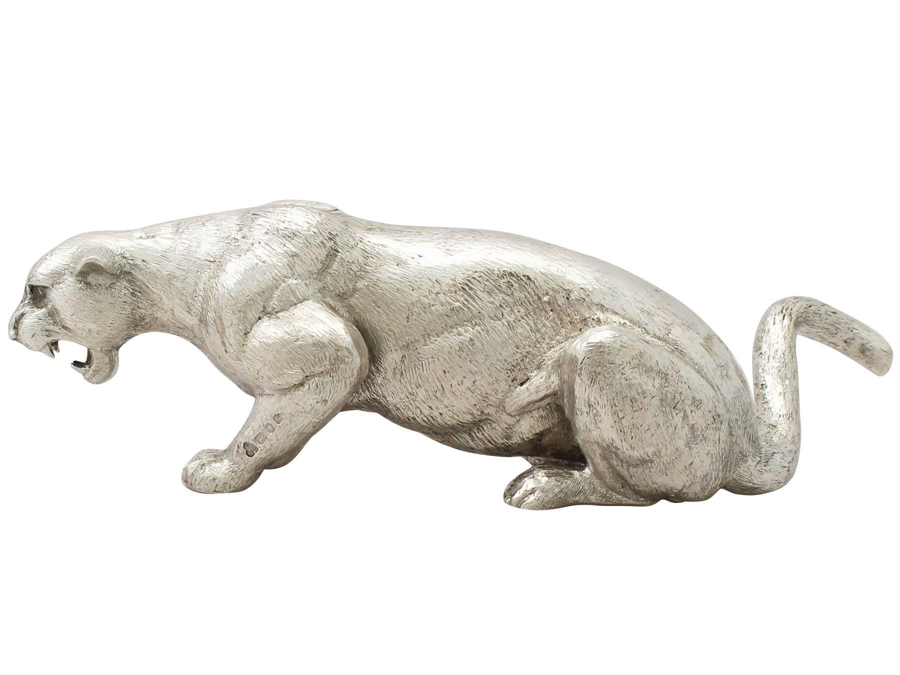 A fine and impressive vintage Elizabeth II English cast sterling silver model in the form of a panther; an addition to our animal related silverware collection.

This fine vintage Elizabeth II English cast sterling silver ornament has been