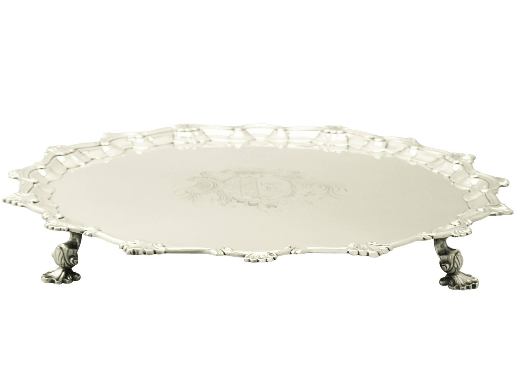A magnificent, fine and impressive, large antique Georgian English sterling silver salver made by William Peaston; an addition to our dining silverware collection.

This magnificent antique George II sterling silver salver has a plain circular