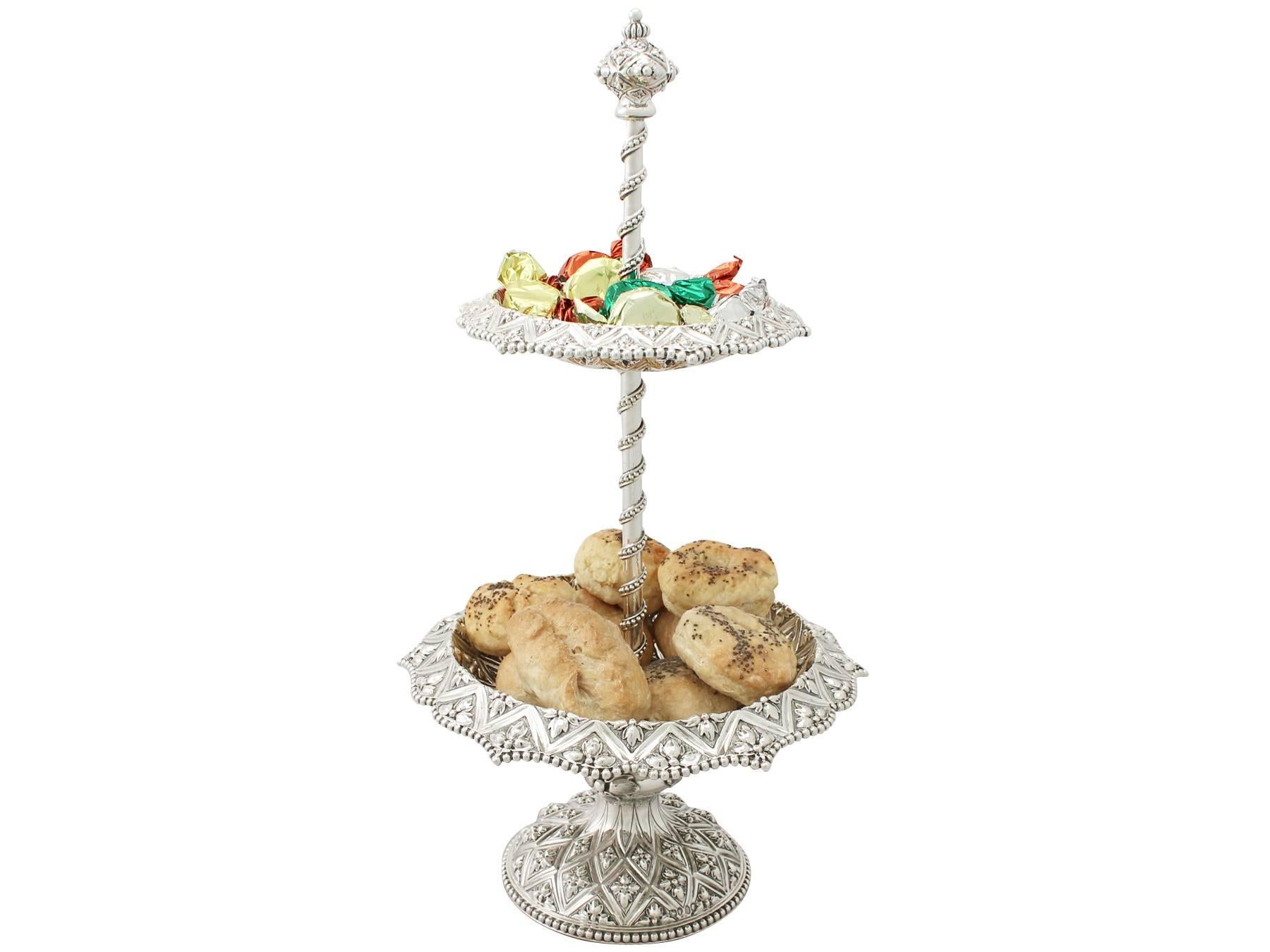 An exceptional, fine and impressive, rare antique Victorian English sterling silver cake stand / centerpiece made by Robert Hennell III; an addition to our range of collectable ornamental silverware.

This exceptional Victorian sterling silver