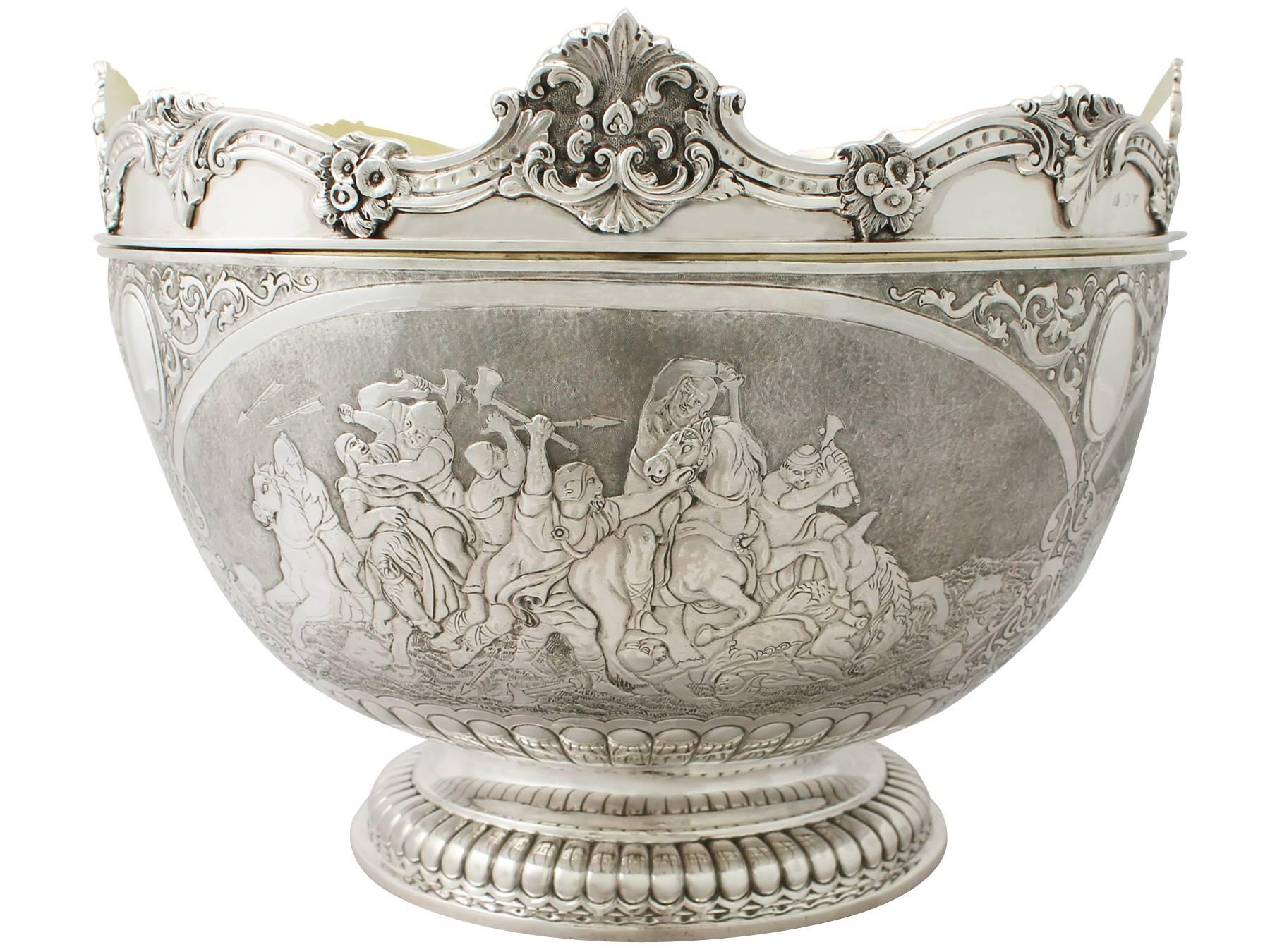 A magnificent, fine and impressive, large antique Victorian English sterling silver Monteith bowl, an addition to our range of collectable silverware.

This magnificent Victorian English sterling silver Monteith bowl has a large circular rounded