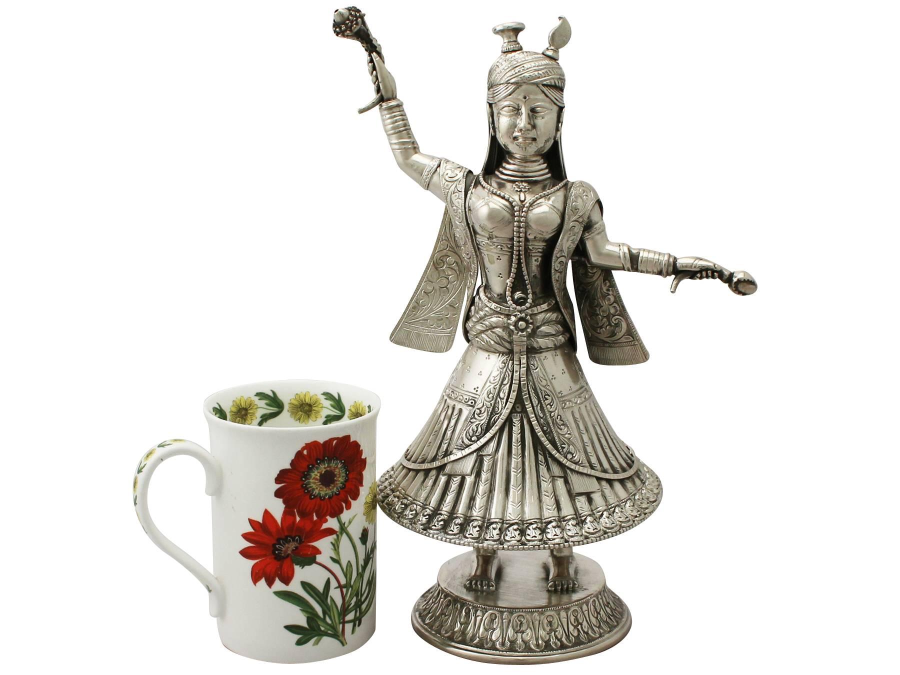 An exceptional, fine and impressive antique Indian 900 standard silver rosewater sprinkler modelled in the form of a dancer; an addition to our diverse ornamental silverware collection

This exceptional antique Indian silver rosewater sprinkler