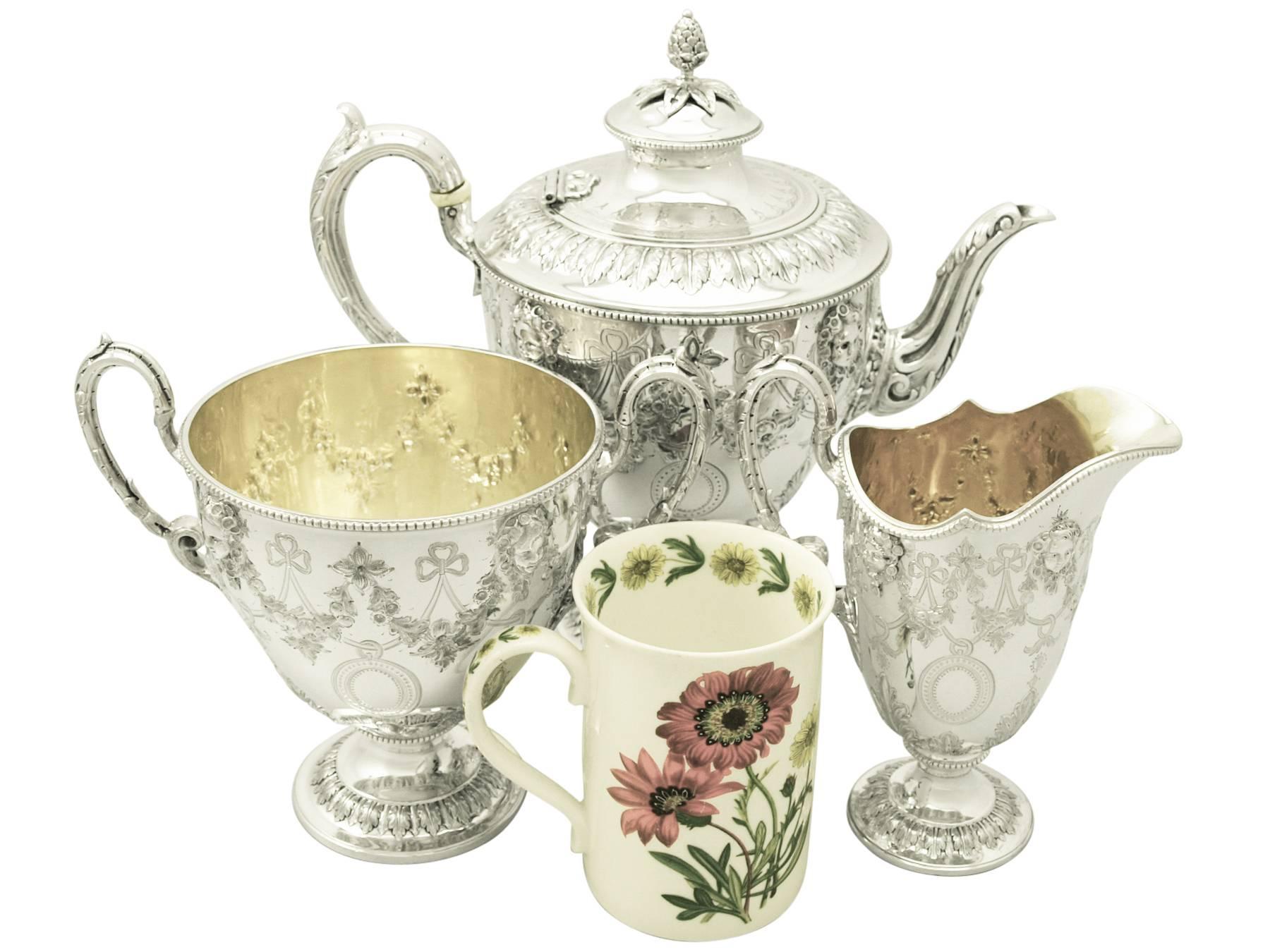 An exceptional antique Victorian English sterling silver three-piece tea service; part of our silver teaware collection.

This fine antique Victorian sterling silver three-piece tea set/service consists of a teapot, cream jug / creamer and sugar