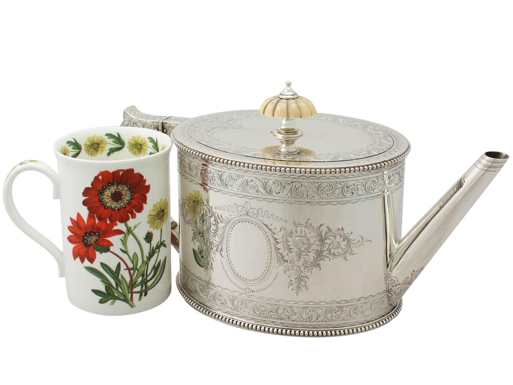 An exceptional, fine and impressive antique Victorian English sterling silver teapot made by Elikington & Co Ltd; an addition to our silver teaware collection

This exceptional antique Victorian sterling silver teapot has an oval can shaped