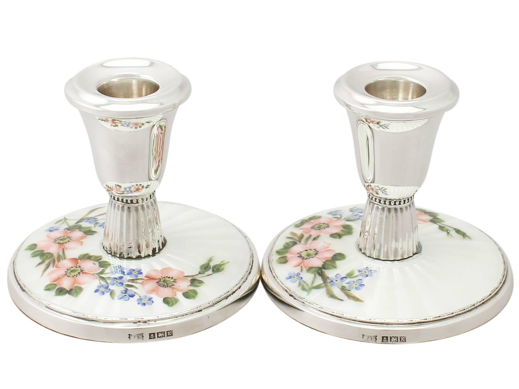 A fine and impressive pair of vintage Elizabeth II English sterling silver and guilloche enamel bedroom/piano candlesticks; an addition to our ornamental silverware collection

These fine vintage Elizabeth II English sterling silver and enamel