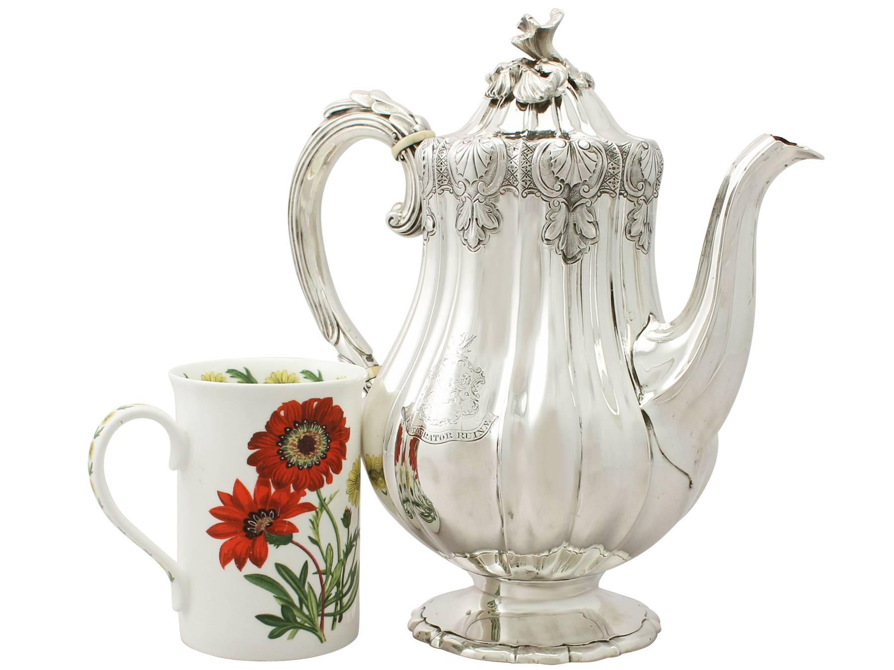An exceptional, fine and impressive antique George IV English sterling silver coffee pot; an addition to our silver teaware collection

This exceptional antique George IV sterling silver coffee pot has a baluster, melon shaped form.

The upper