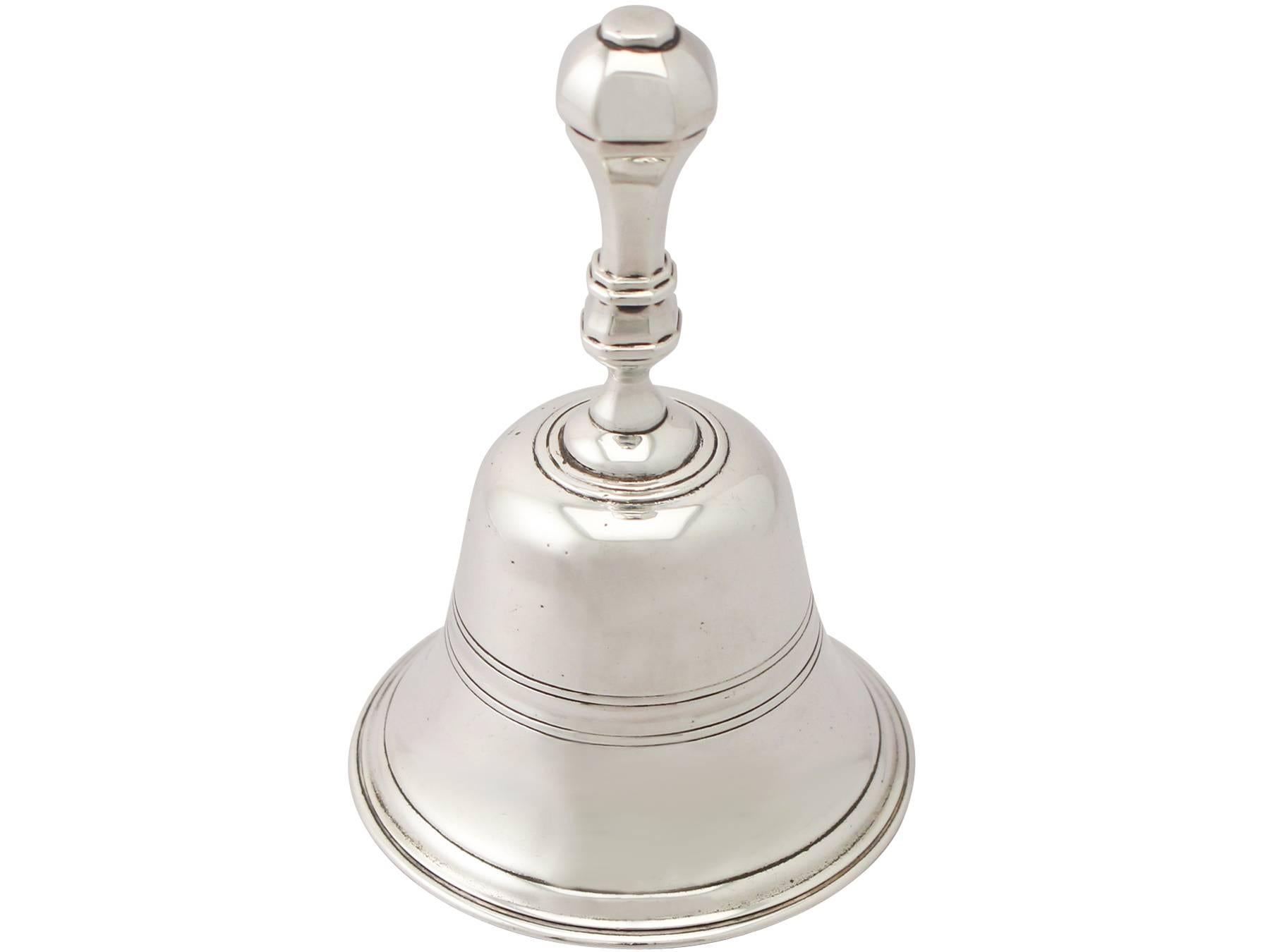 An exceptional, fine and impressive antique Victorian English sterling silver table bell; an addition to our range of ornamental silverware.

This exceptional antique Victorian sterling silver table bell has a plain bell shaped form.

The