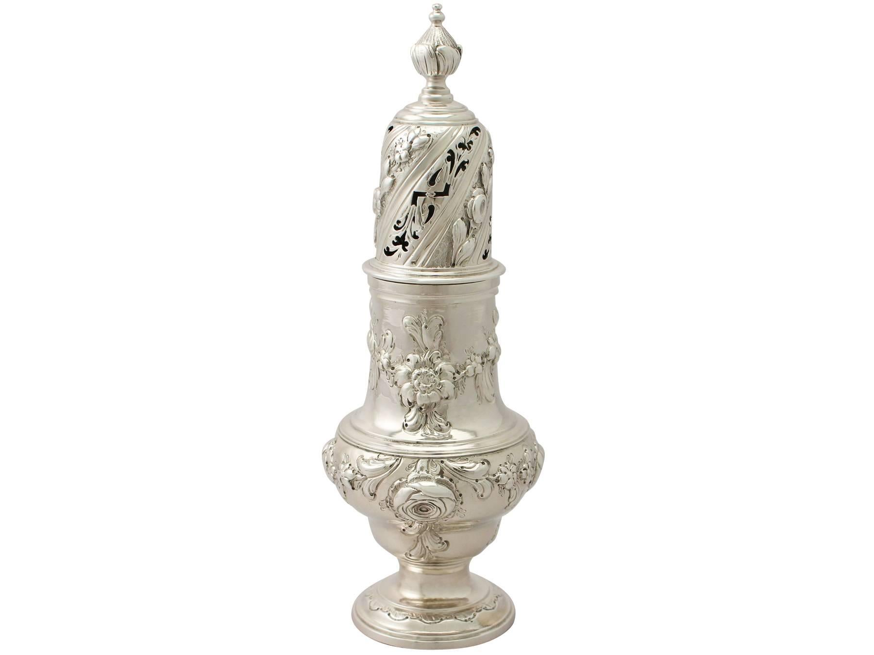 An exceptional, fine and impressive antique George III English sterling silver sugar caster; an addition to our silver Georgian teaware collection

This exceptional antique George III sterling silver sugar caster has a plain baluster shaped form