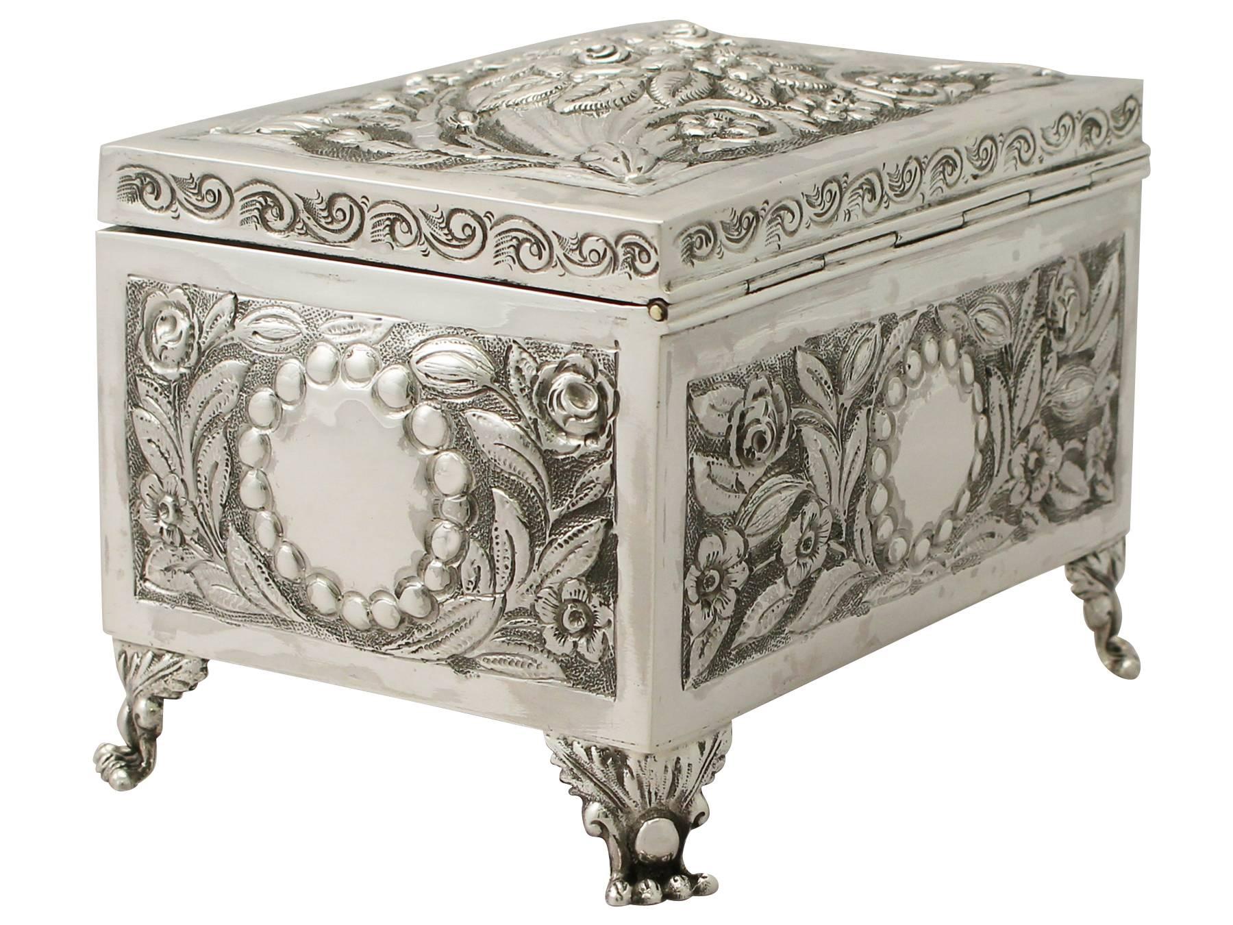 An exceptional, fine and impressive antique Edwardian English sterling silver box/jewelry casket; an addition to the ornamental silverware collection.

This exceptional antique Edwardian sterling silver box has a rectangular form onto four Regency
