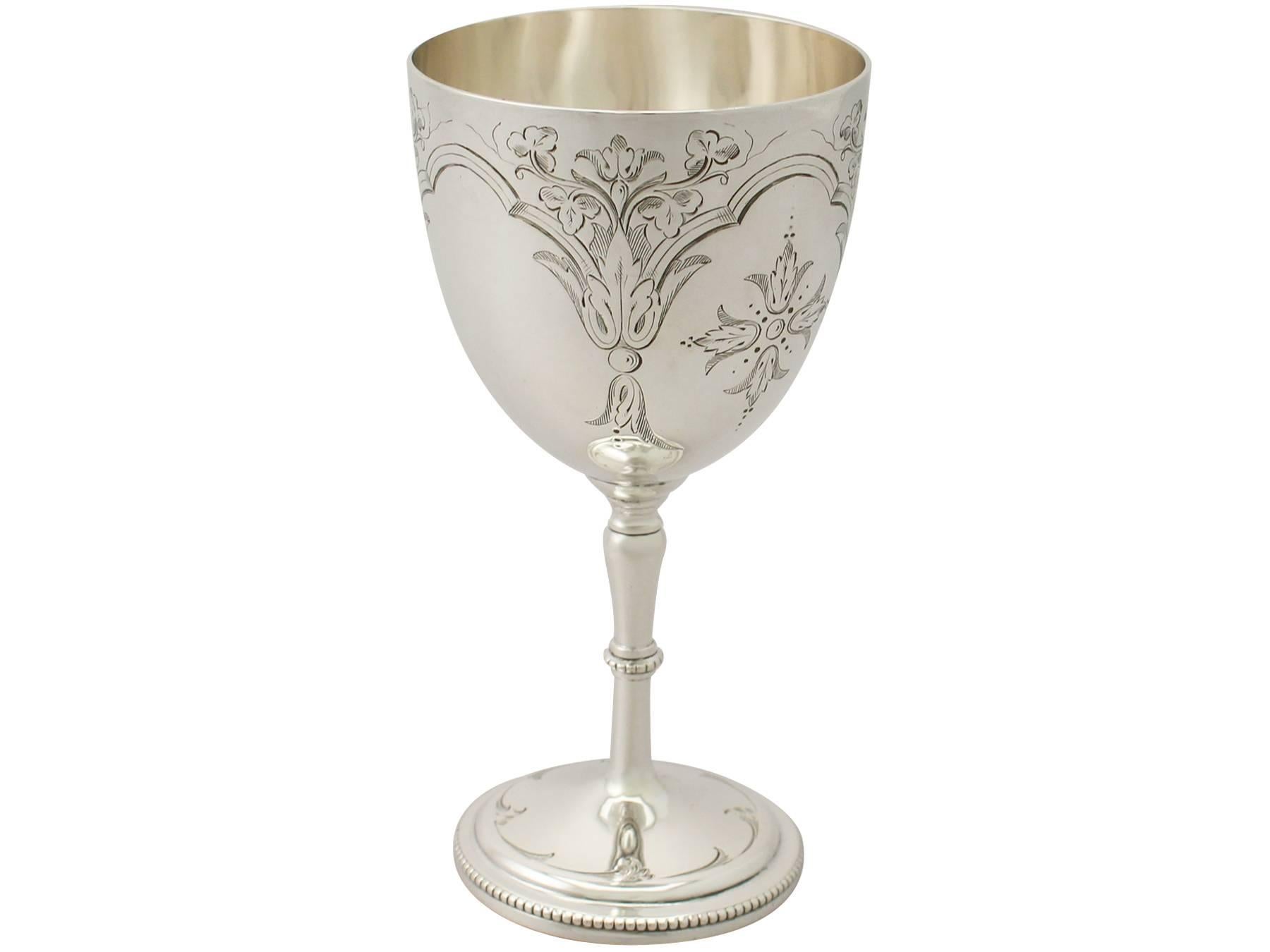 An exceptional, fine and impressive antique Victorian English sterling silver goblet; an addition to our collection of wine and drinks related silverware.

This fine antique Victorian sterling silver goblet has a circular bell shaped form onto a