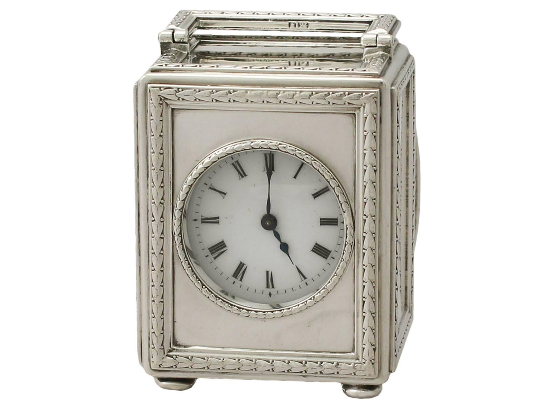 An exceptional, fine and impressive antique Edwardian English sterling silver boudoir clock; part of our antique silver timepiece collection

This exceptional antique Edwardian sterling silver boudoir clock has a rectangular form onto four bun