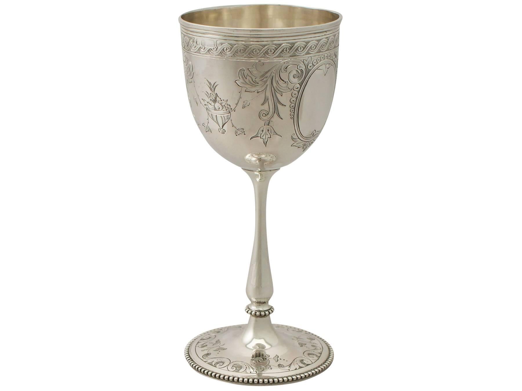 A fine and impressive antique Victorian English sterling silver wine goblet; an addition to our collection of wine and drinks related silverware

This fine antique Victorian sterling silver wine goblet has a circular bell shaped form onto a
