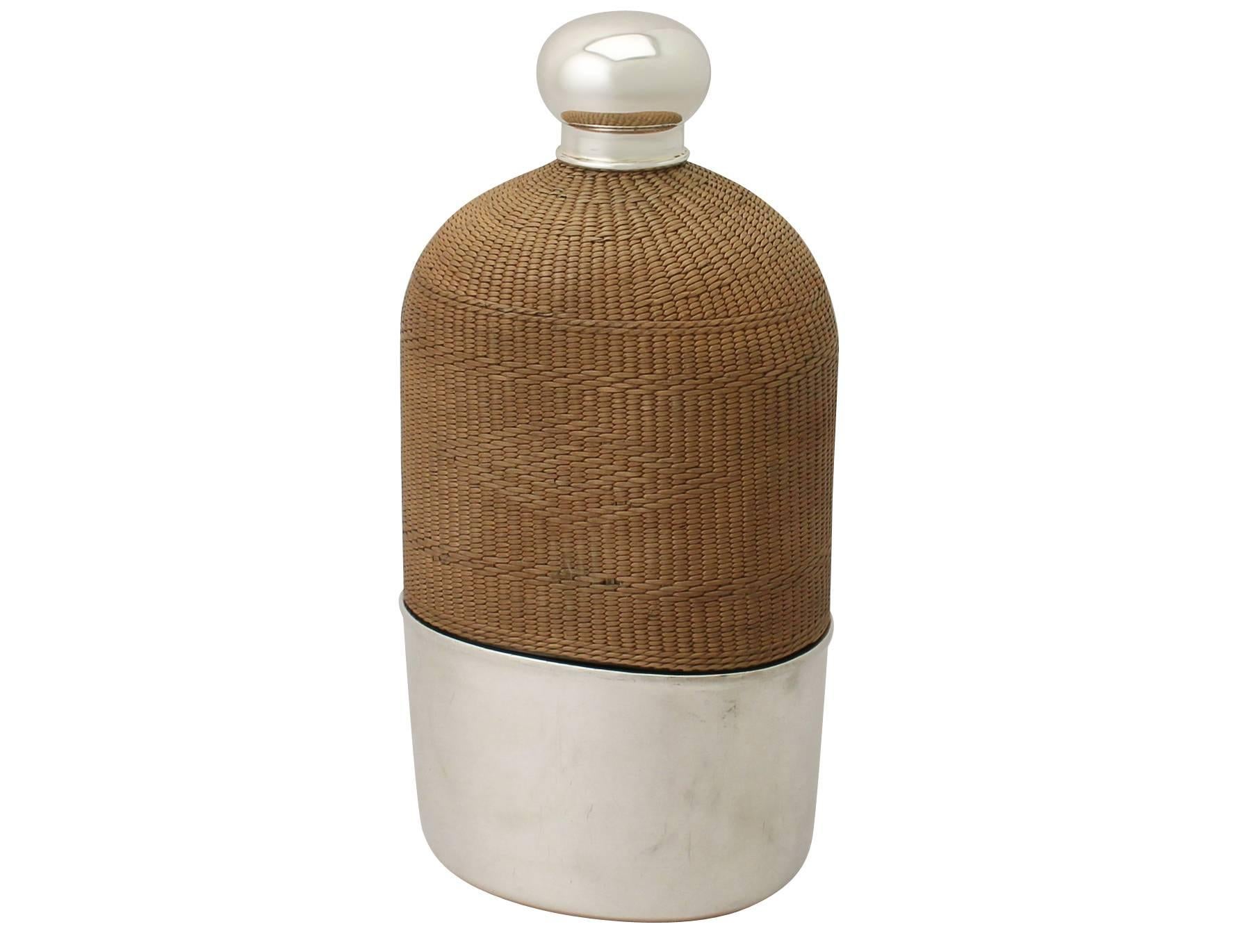 An exceptional, rare, fine and impressive, large antique Georgian glass, Newcastle sterling silver and wicker mounted hip flask made by Isaac Cookson; an addition to our silver mounted glass collection.

This exceptional antique George II