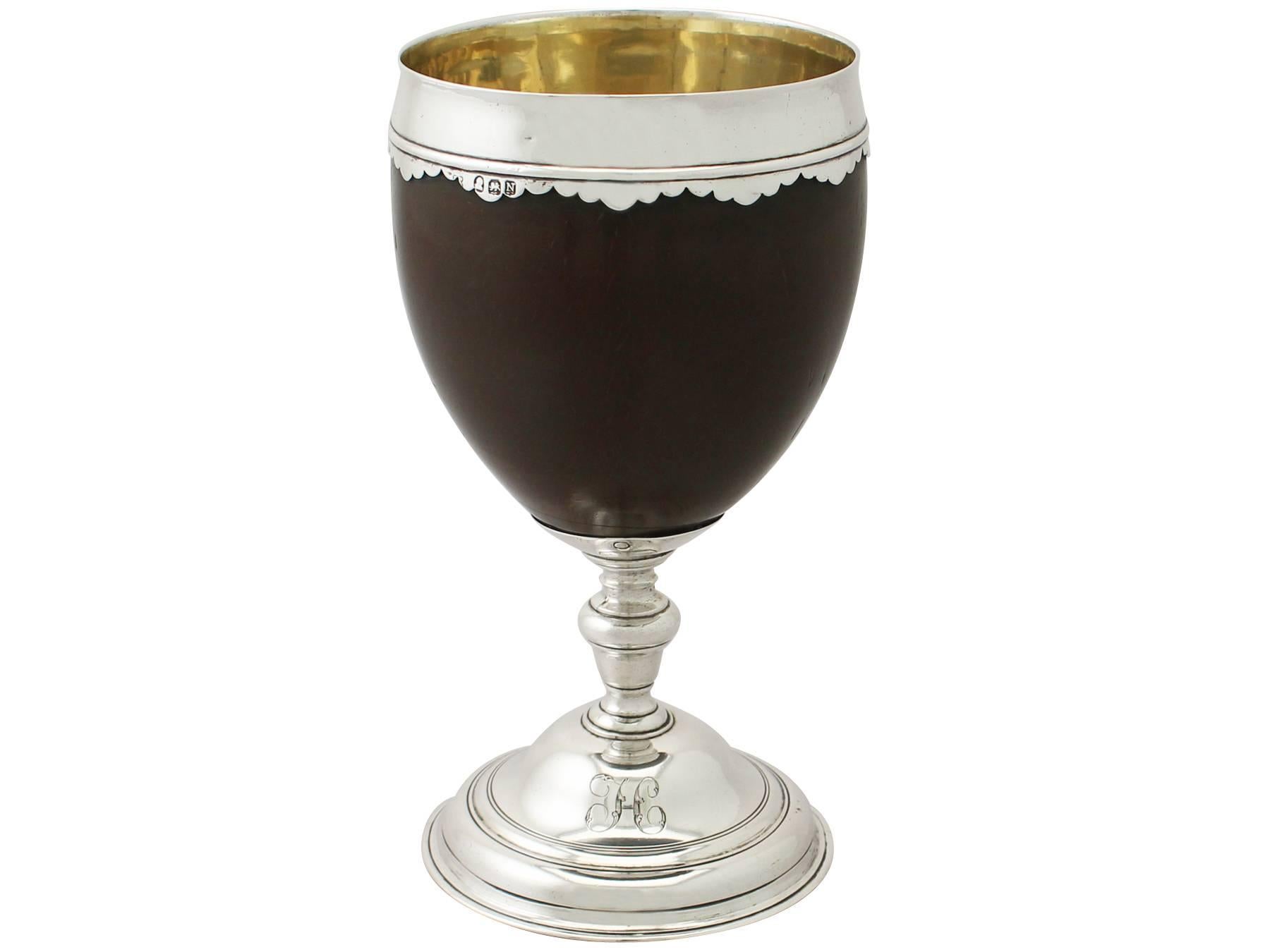 An exceptional, fine and impressive antique George III English sterling silver mounted coconut cup; an addition to our diverse Georgian silverware collection.

This exceptional antique George III sterling silver mounted coconut cup has a circular