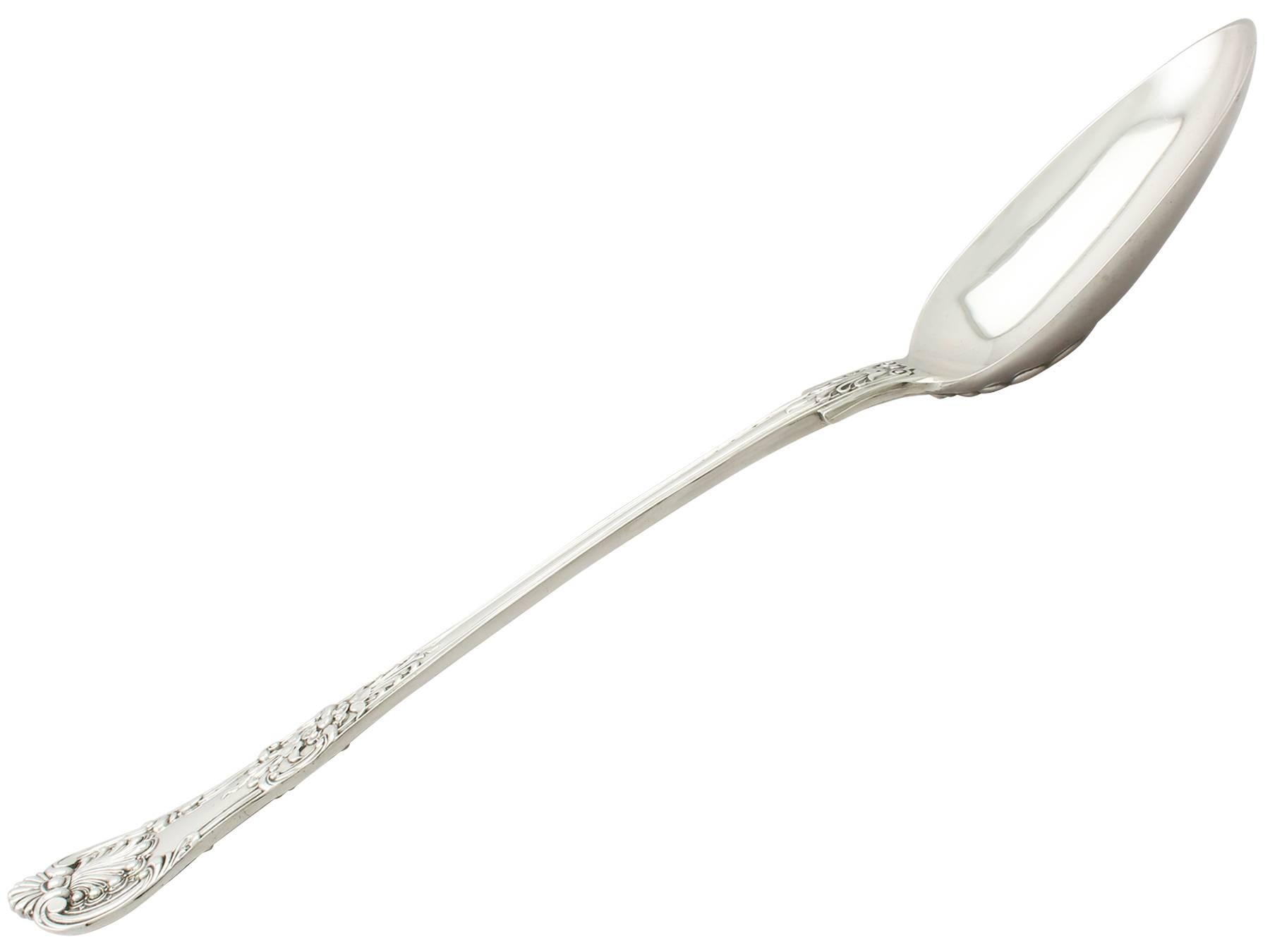 An exceptional, fine and impressive, antique Victorian English sterling silver Queen's pattern gravy spoon made by George William Adams; an addition to our silver flatware collection

This exceptional antique Victorian sterling silver gravy spoon