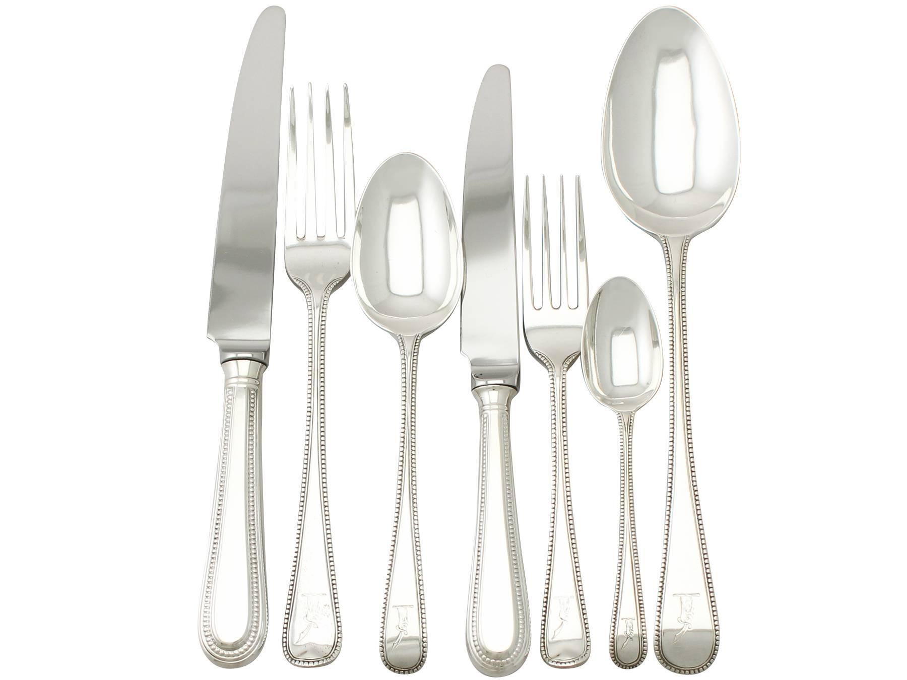 An exceptional, fine and impressive antique George V English sterling silver straight Old English Bead pattern flatware set / service for 12 persons; an addition to our canteen of cutlery collection.

The pieces of this exceptional, antique George
