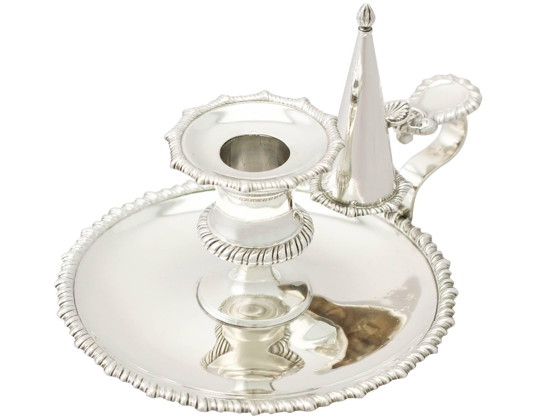 An exceptional, fine and impressive antique Edwardian English sterling silver chamber candlestick; an addition to our silver candlestick/candelabra collection.

This exceptional antique Edwardian sterling silver chamber candlestick (chamberstick)