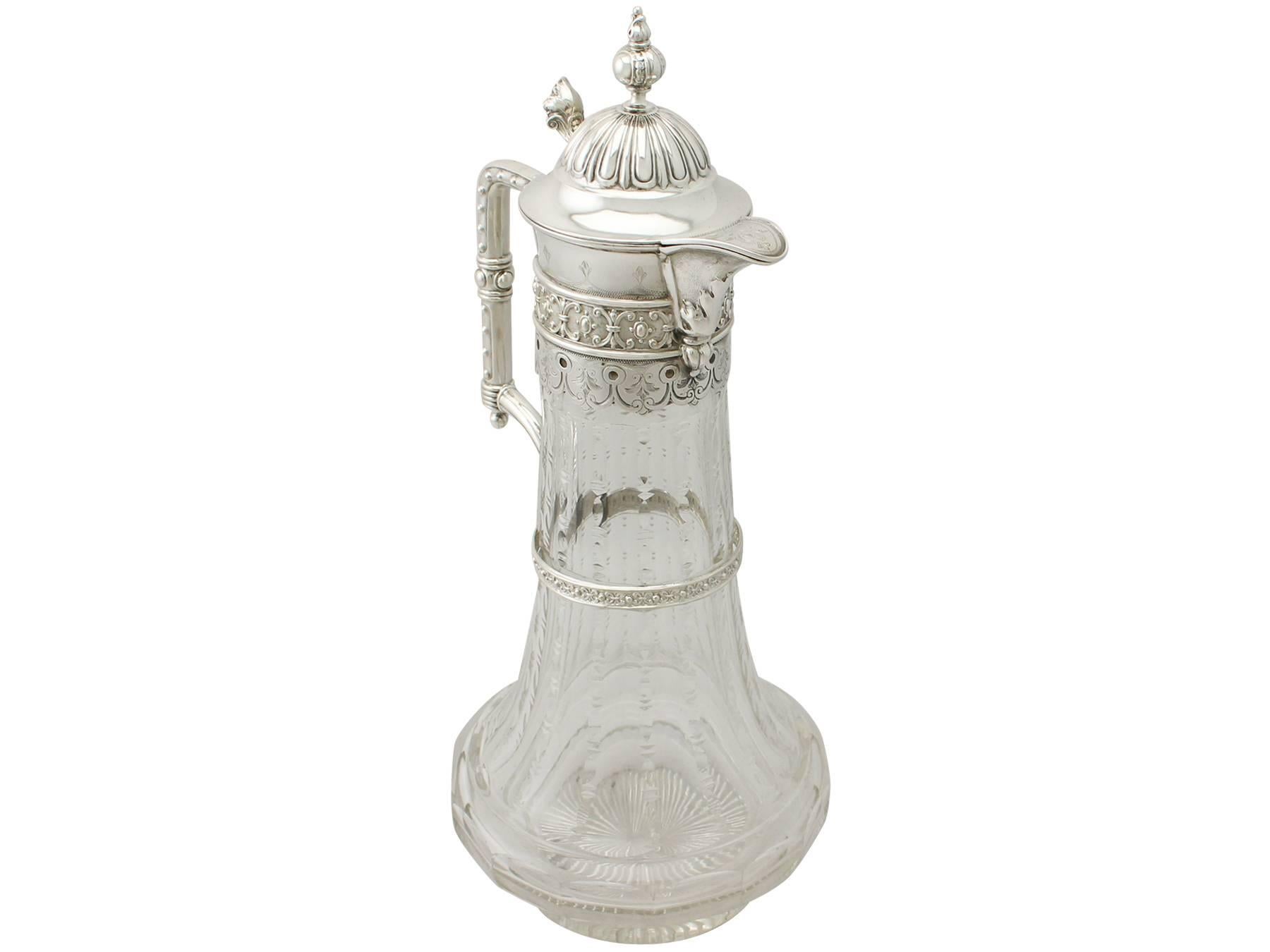 An exceptional, fine and impressive antique cut-glass and German silver mounted claret jug, an addition to our wine and drink related collection.

This exceptional antique German 800 standard silver and glass claret jug has a cylindrical, tapering