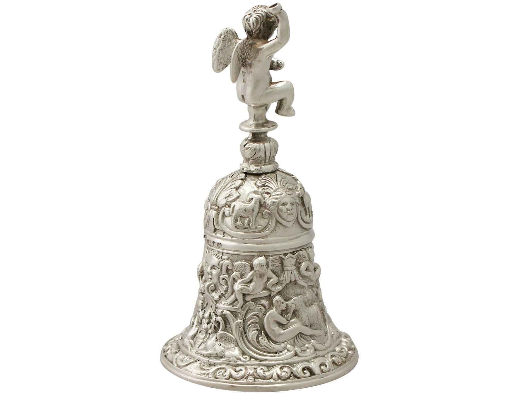 An exceptional, fine and impressive vintage Elizabeth II English silver table bell; an addition to our ornamental silverware collection.

This exceptional vintage Elizabeth English sterling silver table bell has a bell shaped form, modelled in the