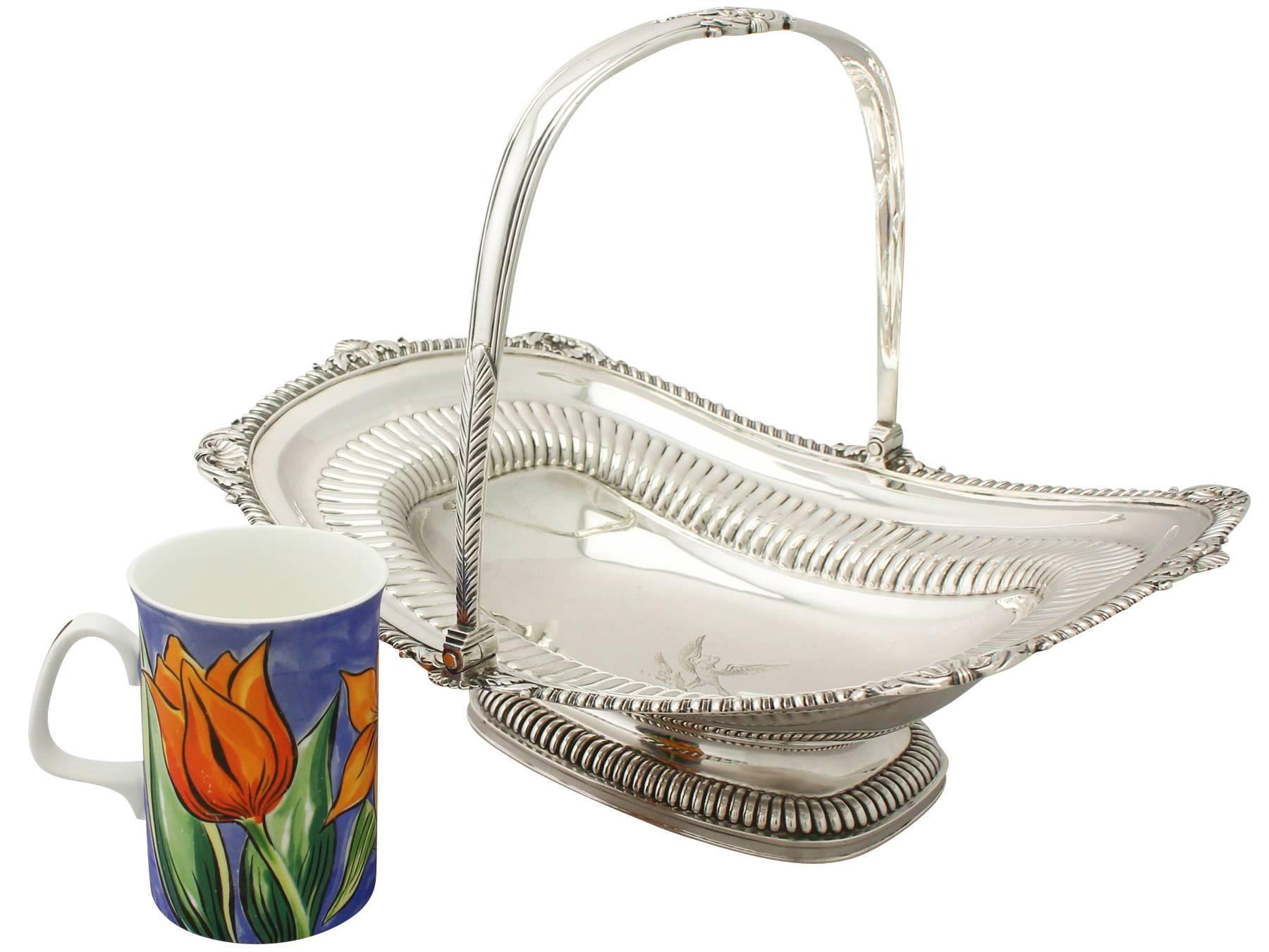An exceptional, fine and impressive antique Georgian English sterling silver swing handled cake basket made by Paul Storr; an addition to our ornamental silverware collection.

This exceptional antique George III sterling silver cake basket has a