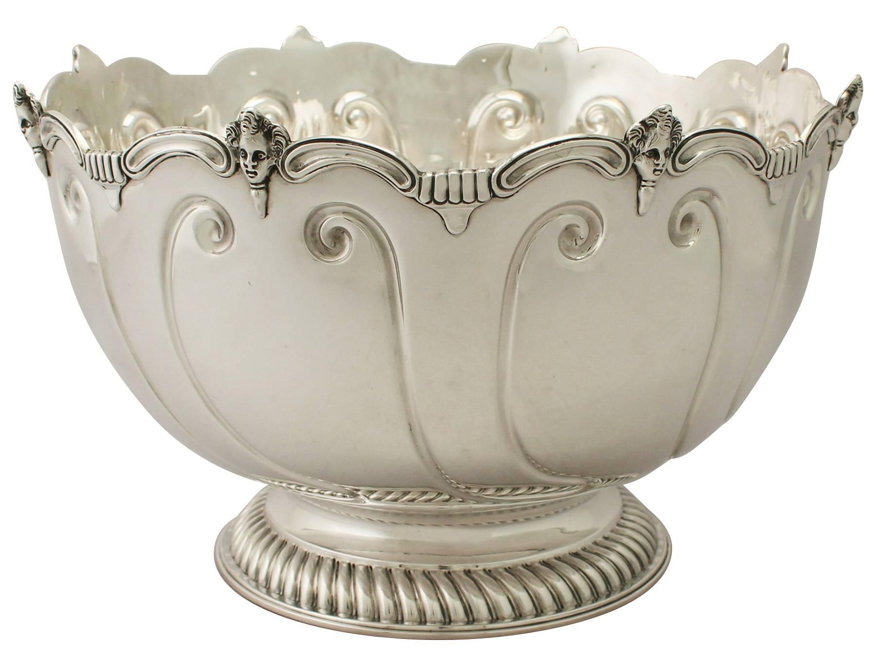 A magnificent, fine and impressive, large antique Edwardian English sterling silver Monteith style presentation bowl made by Charles Stuart Harris; an addition to our ornamental silverware collection.

This magnificent antique Edwardian sterling