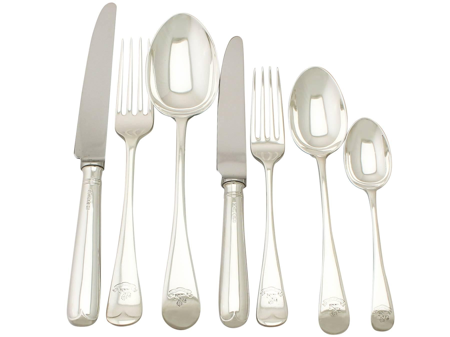 An exceptional, fine and impressive antique Edwardian English sterling silver straight Old English pattern flatware set / service for 12 persons; an addition to our canteen of cutlery collection.

The pieces of this exceptional, antique Edwardian