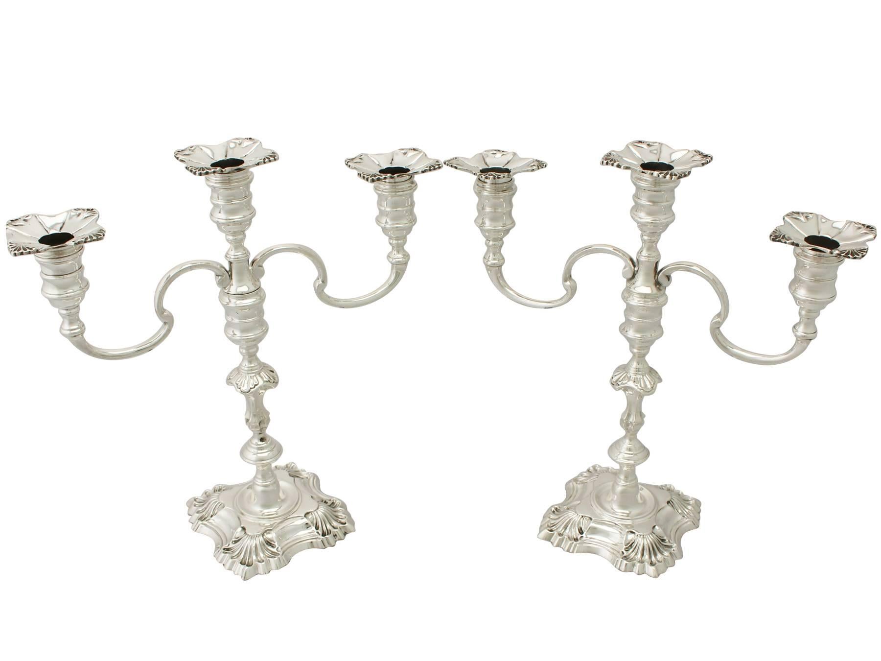 An exceptional, fine and impressive pair of vintage Elizabeth II English cast sterling silver three-light candelabra; an addition to our ornamental silverware collection.

These exceptional vintage Elizabeth II sterling silver candelabra have a