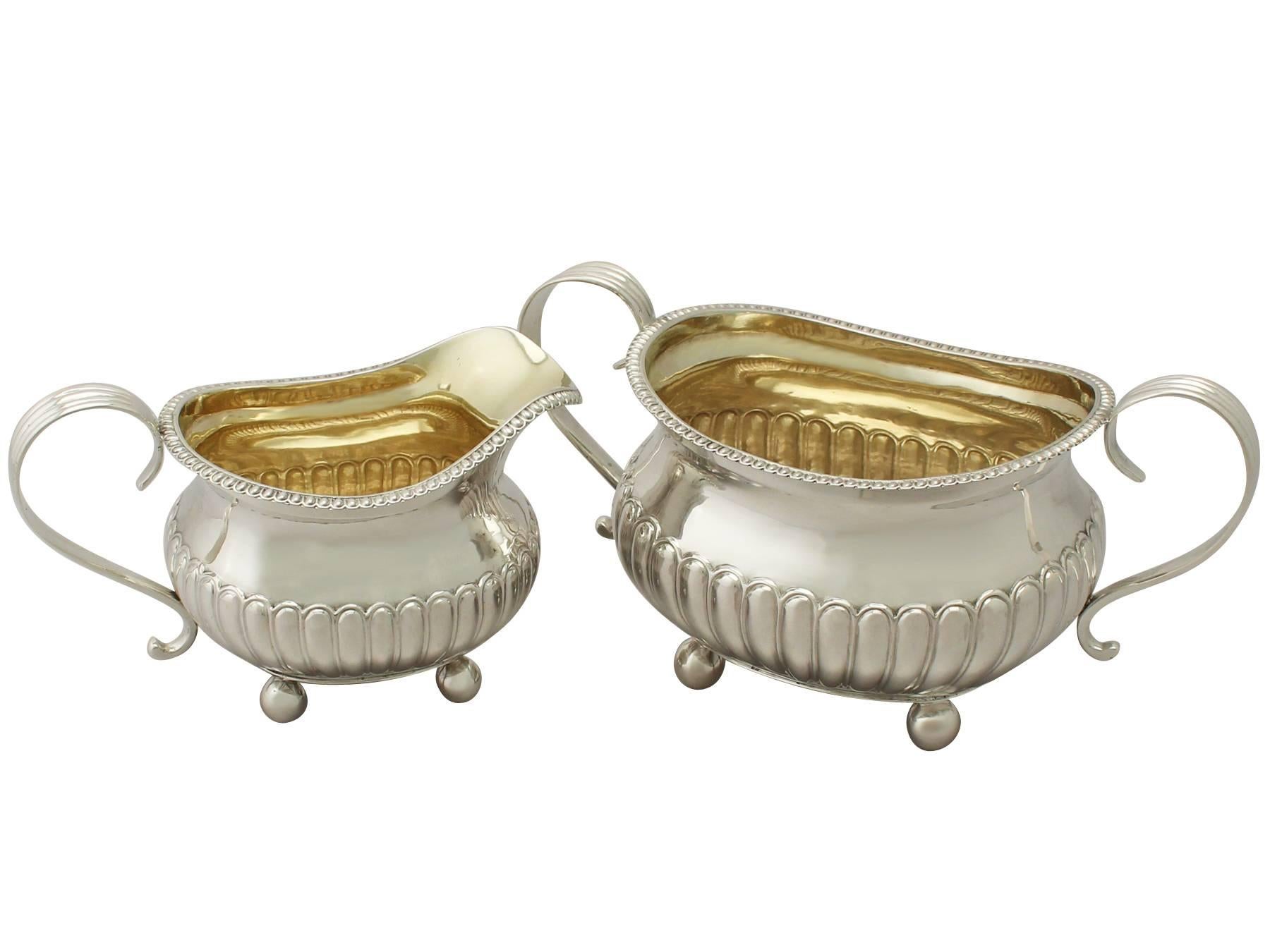 An exceptional, fine and impressive antique George III English sterling silver cream jug and sugar bowl set; an addition to our Georgian silver teaware collection.

This exceptional antique George III English sterling creamer and sugar bowl have a