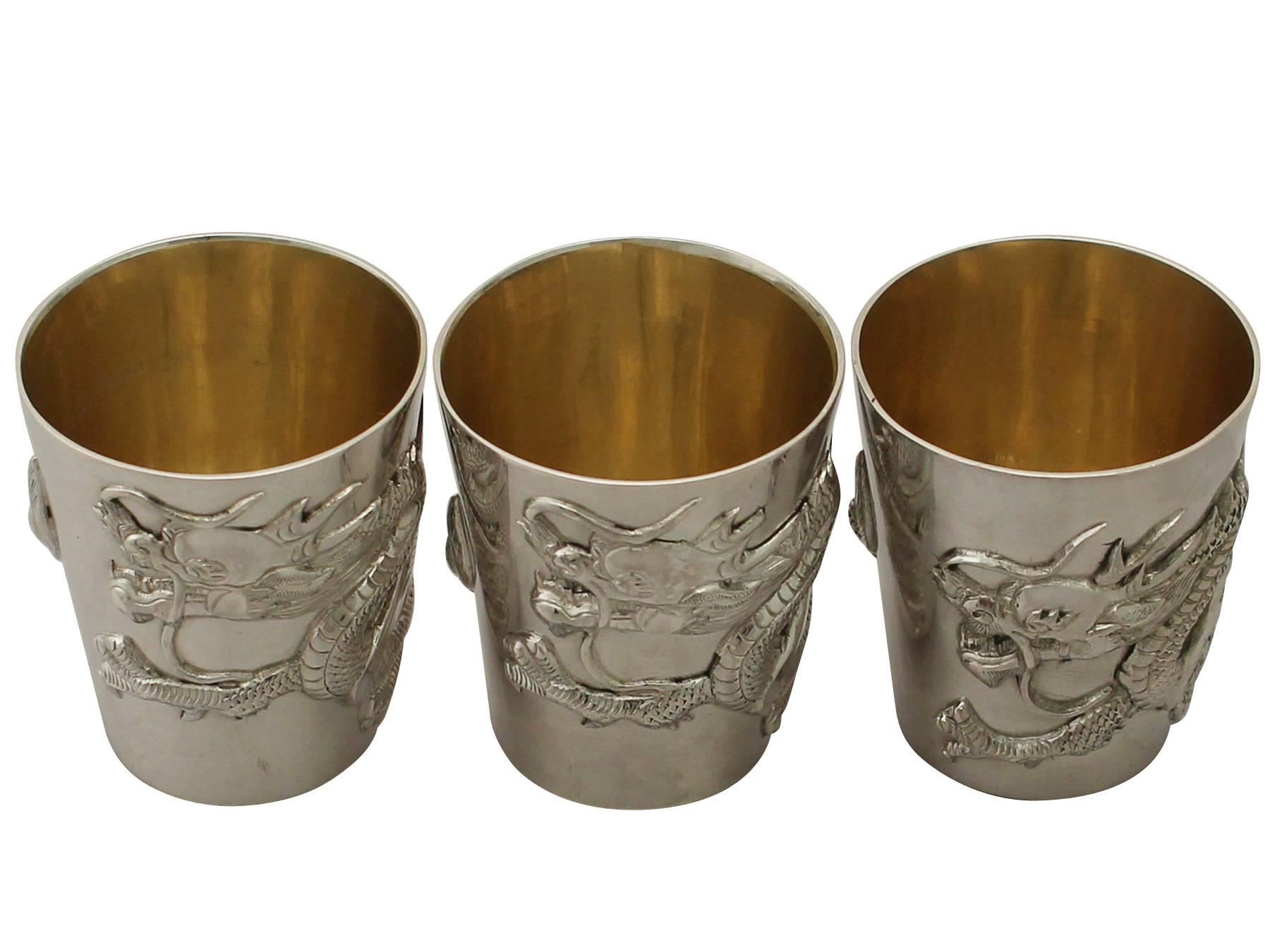 A fine and impressive set of antique Chinese export silver beakers or tots; part of our Asian silverware collection.

This impressive antique Chinese export silver tot or beaker set has a tapering cylindrical tapering form.

The surface of each