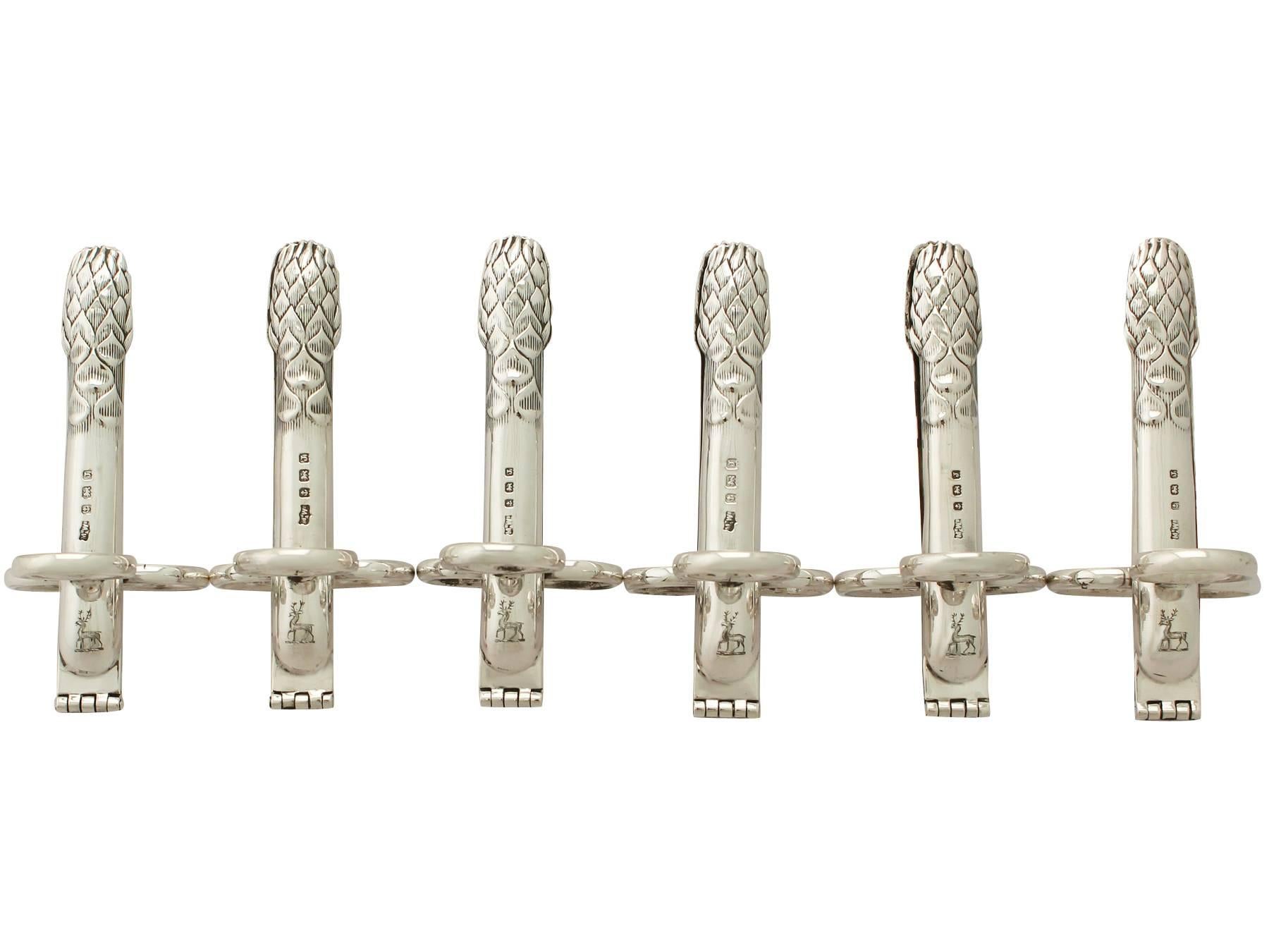 An exceptional, Fine and impressive, unusual set of six antique George V English sterling silver asparagus tongs - boxed; an addition to our silver dining collection.

This exceptional antique George V set of six asparagus tongs have been modelled