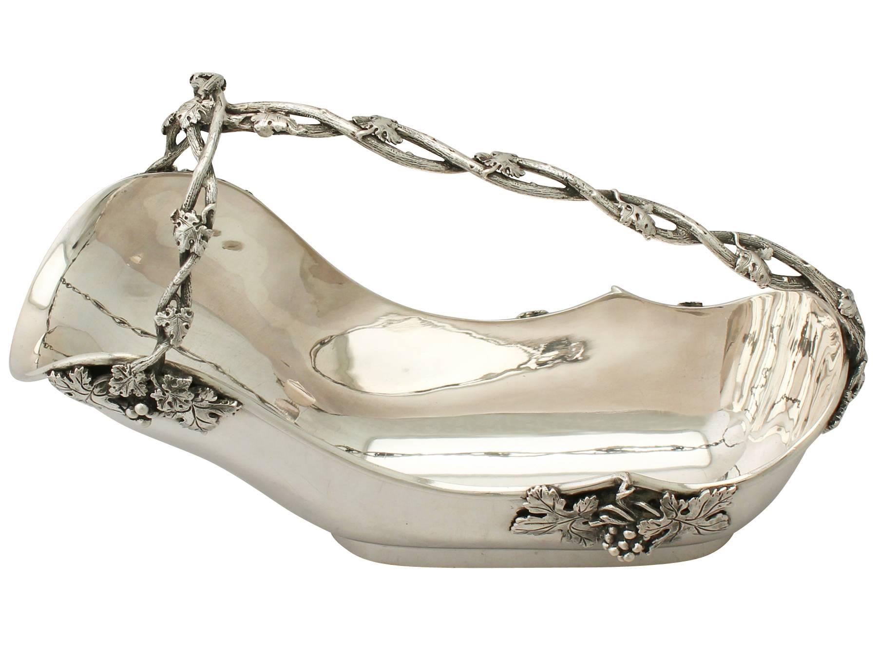 An exceptional, fine and impressive vintage Italian silver bottle holder; an addition to our ornamental silverware collection.

This fine vintage Italian silver bottle holder has an oval rounded form onto an oval collet foot.

The body of this