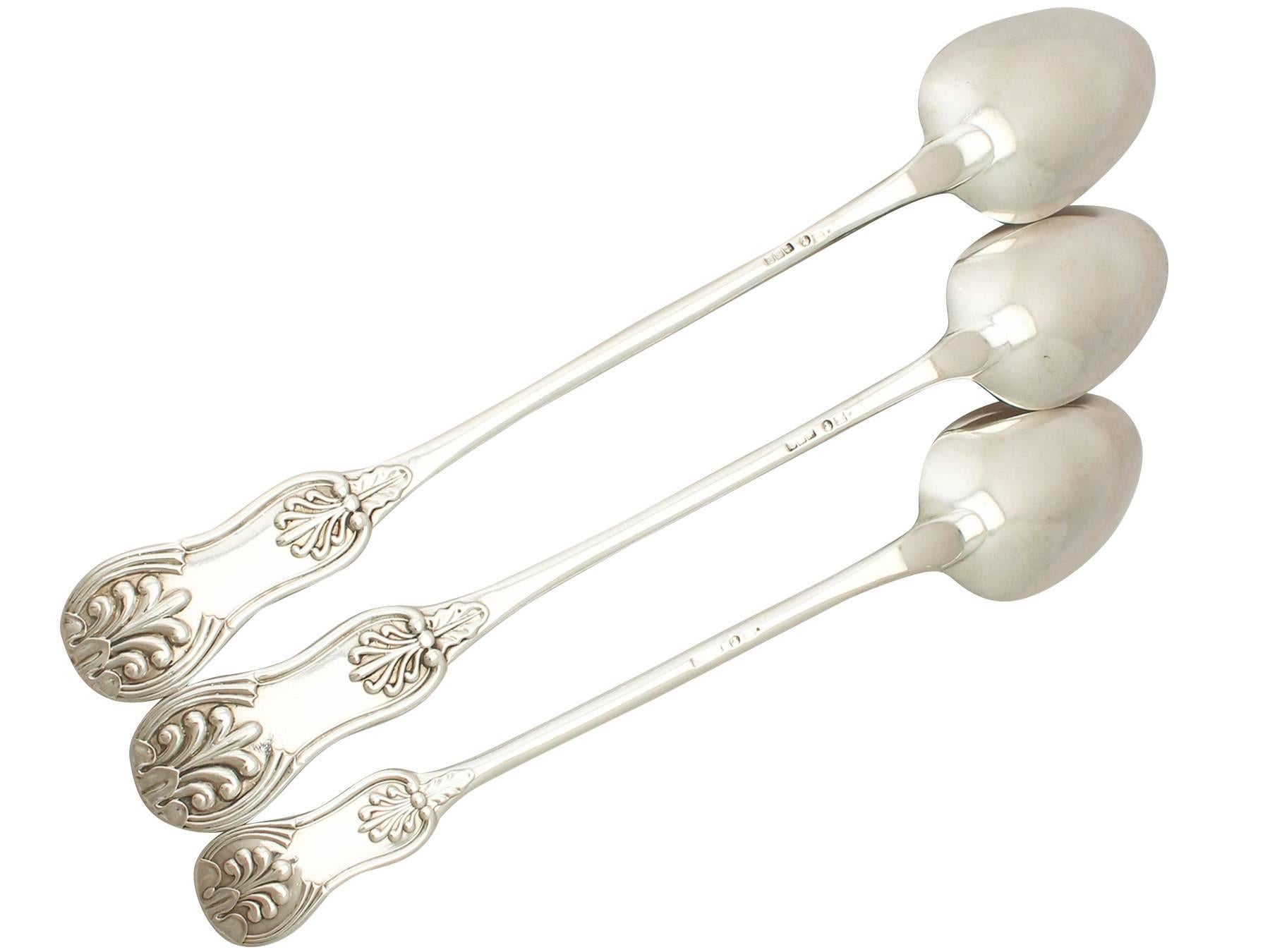 An exceptional, fine and impressive set of antique Victorian English sterling silver King's pattern basting spoons; an addition to our silver flatware collection.

These exceptional antique Edwardian English sterling silver basting spoons have