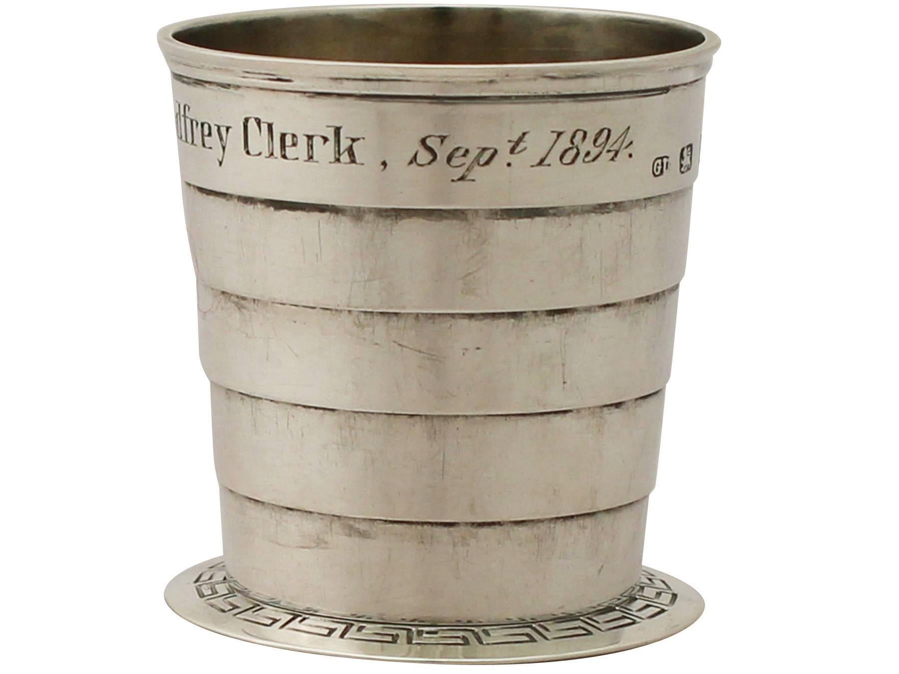 A fine and impressive antique Victorian English sterling silver collapsible beaker; an addition to our ornamental silverware collection.

This impressive antique Victorian sterling silver travelling collapsible beaker has a circular tapering form