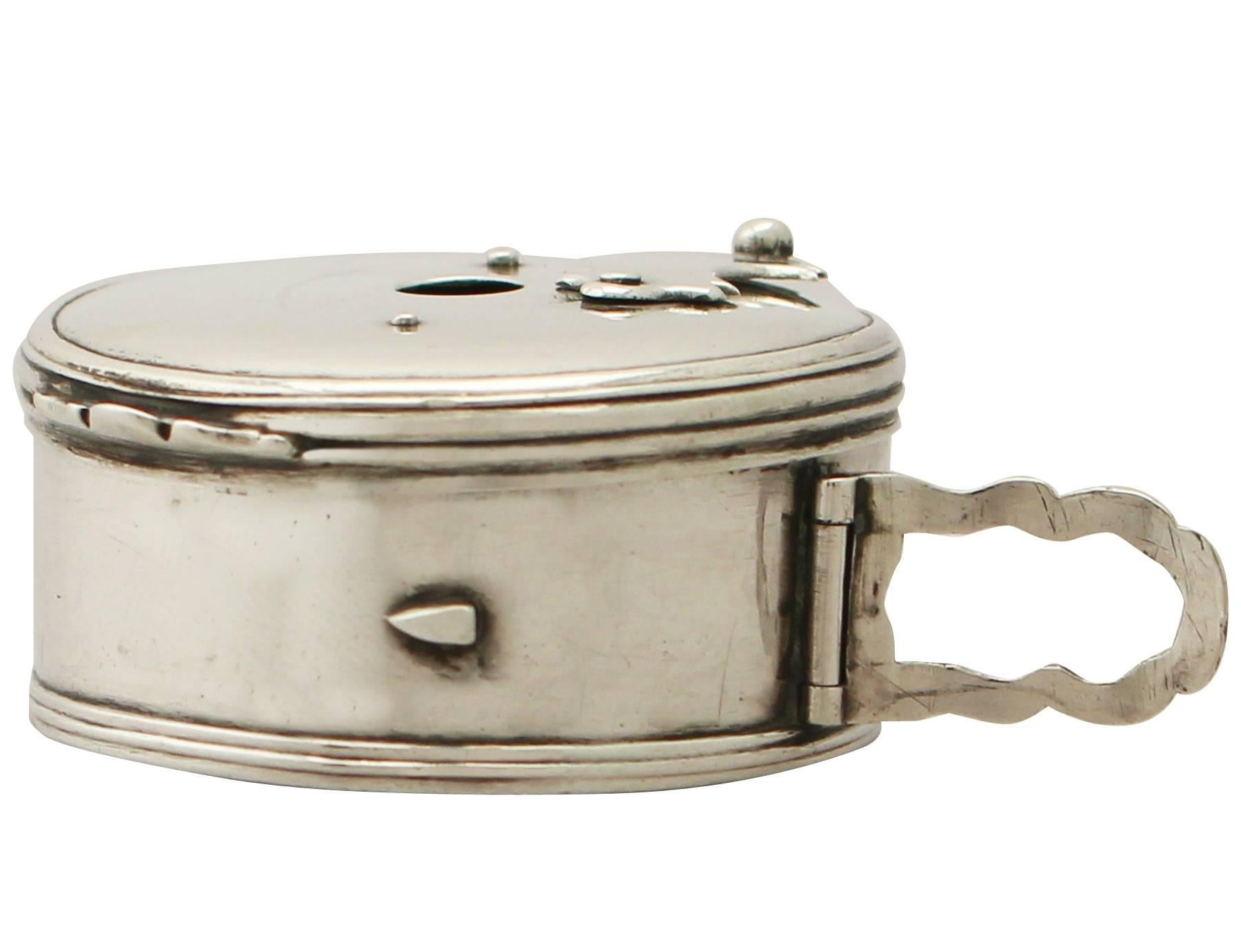 An exceptional, fine and impressive antique Georgian English sterling silver bougie box, an addition to our 18th century silverware collection.

Description.

This exceptional antique George III sterling silver bougie box has a circular rounded