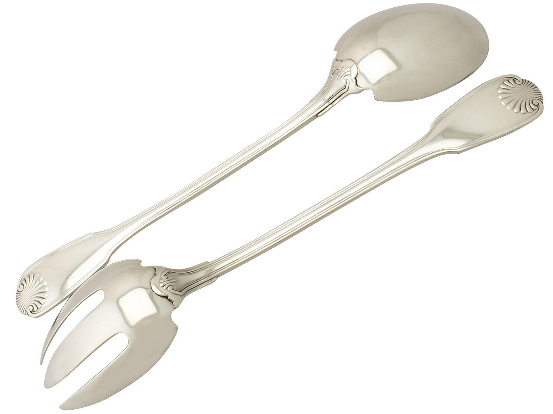 A fine and impressive pair of vintage French silver Fiddle thread and shell pattern salad spoons; an addition to our silver flatware collection.

These fine vintage French silver salad servers have been crafted in the fiddle thread and shell